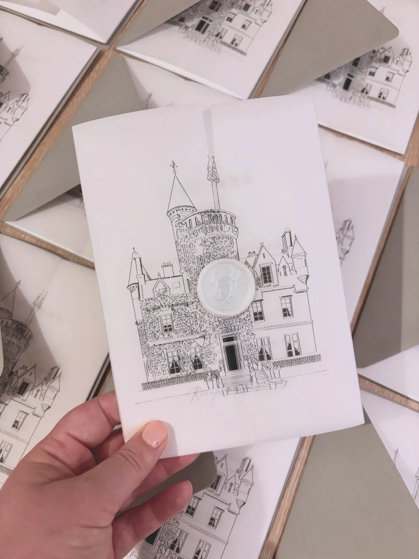 Continuing the current theme with a hand drawn venue illustration of @carlowrie_castle on vellum wraps for a special friend getting married this year 🤍 Combined with the stunning @magnapapers sage green envelopes and a perfect pearl wax seal, this s