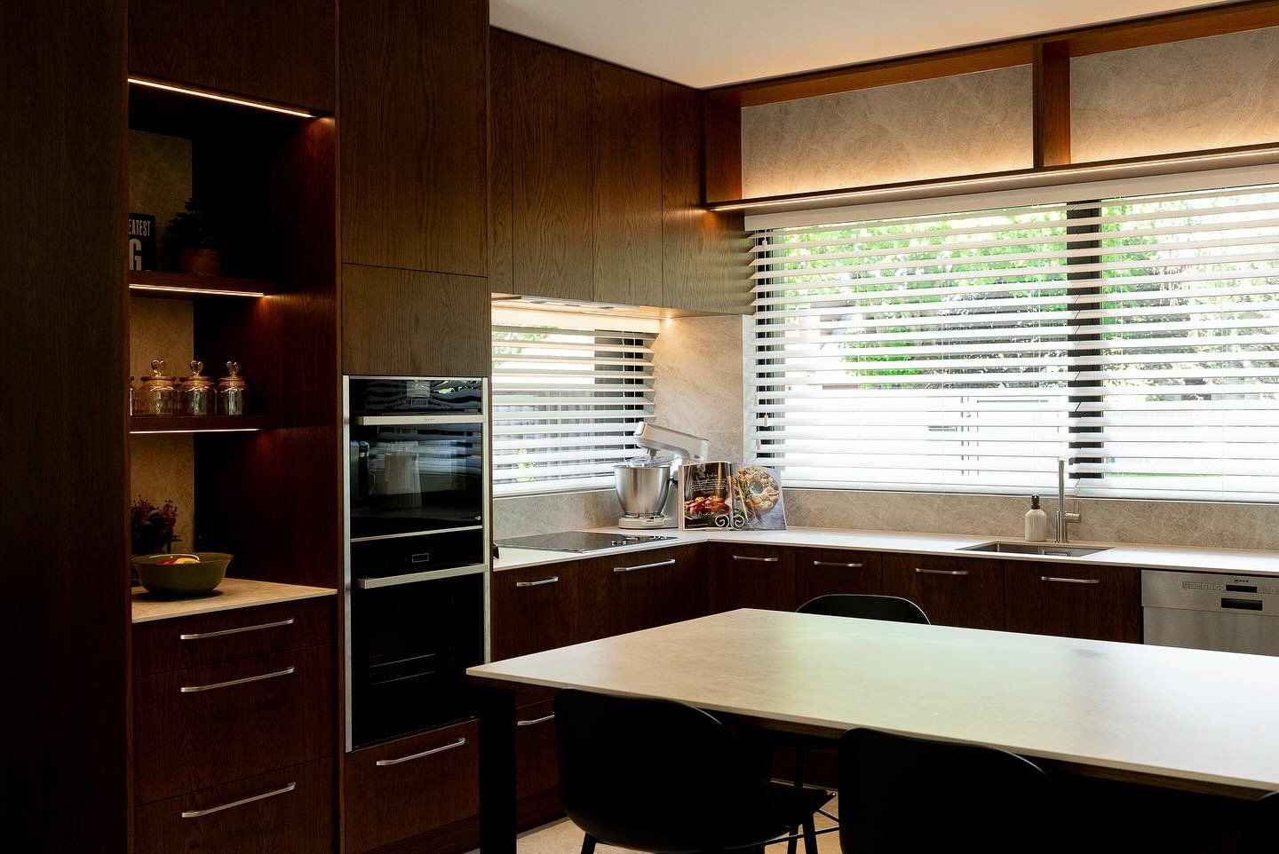 Bringing timeless elegance to your home 🌿✨ The Cornerstone on Cashmere kitchen showcases warm earthy tones and rustic timber veneer, complemented by practical porcelain benchtops. With ample seating on the island, perfect for entertaining, this kitc