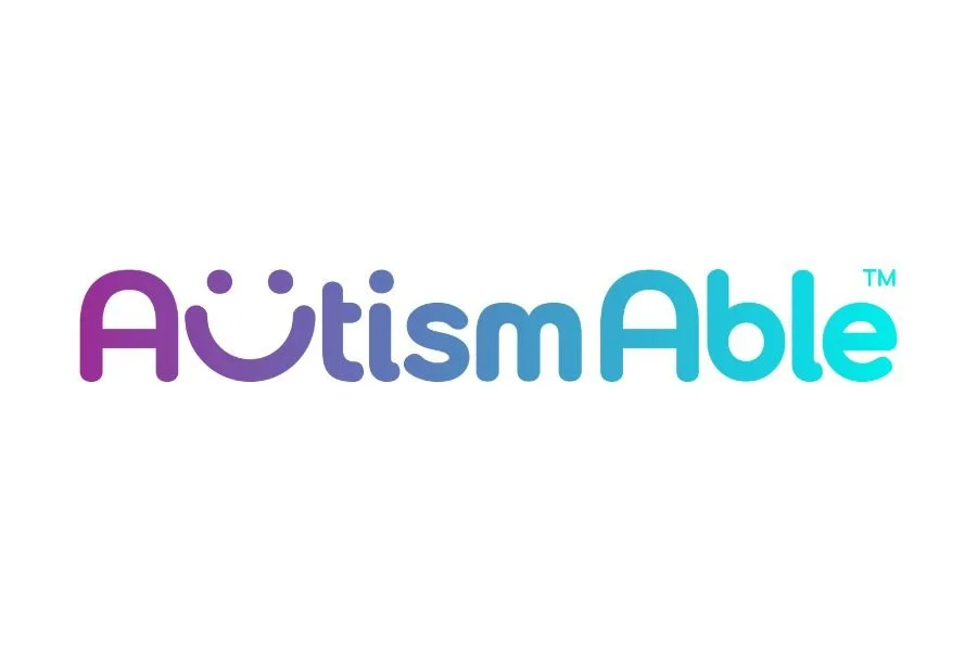 Logo with the text 'AutismAble' in a gradient from purple to blue.