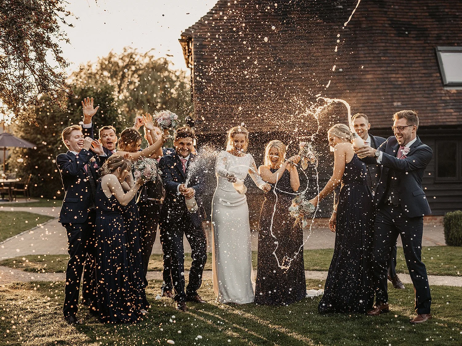 golden hour celebration with champagne spray