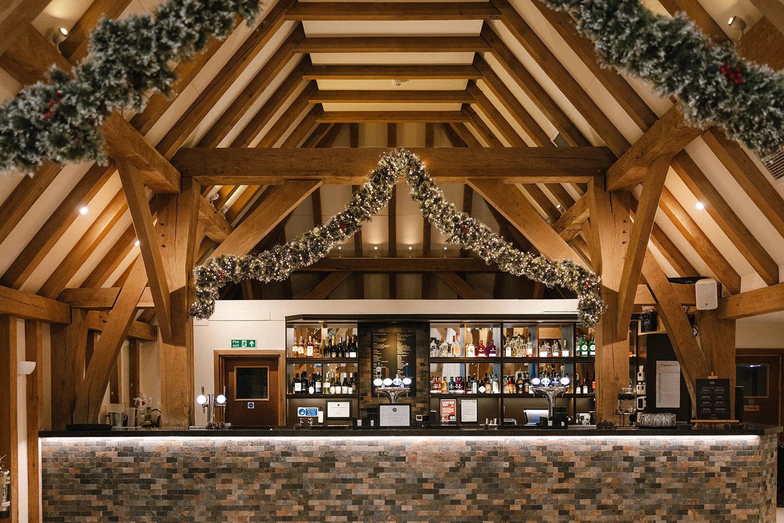 Christmas party at The Old Kent Barn in Kent - bar area with festive decor