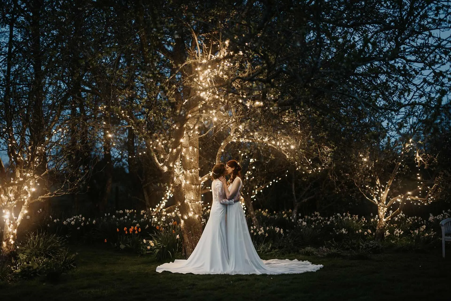 illuminated gardens with couple at spring