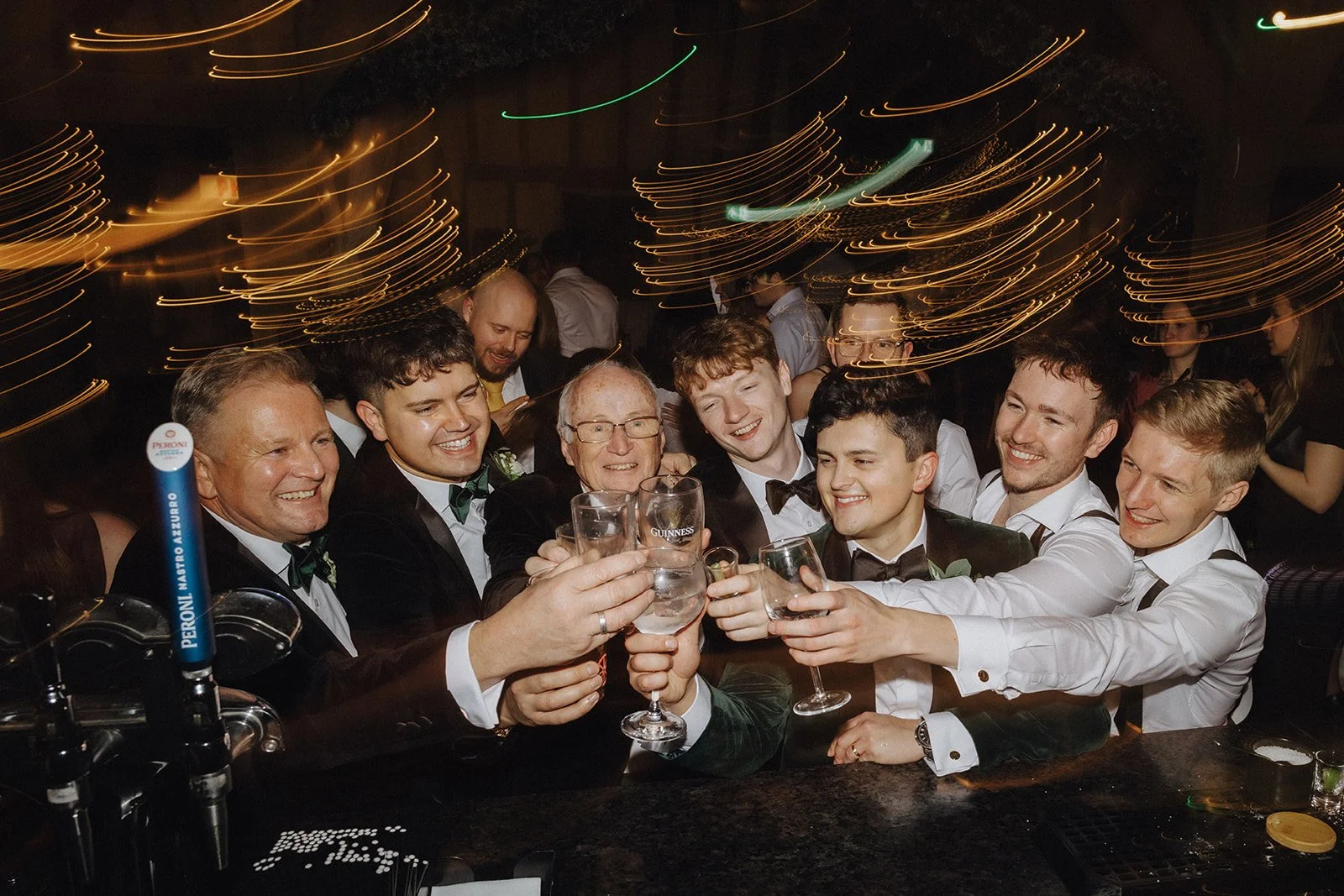 Christmas party at The Old Kent Barn in Kent guests cheers at the bar