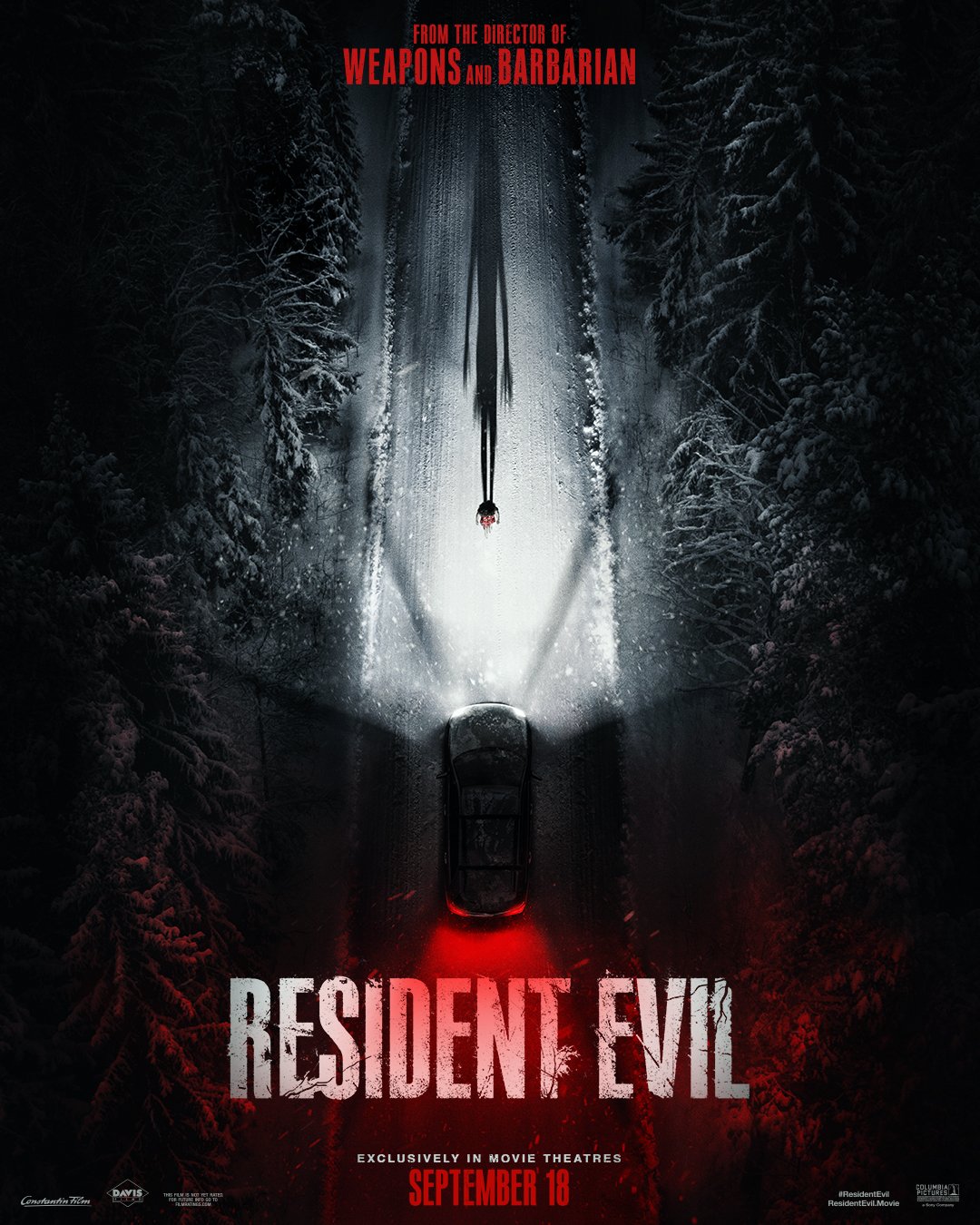 A snowy forest at night with a black car in the middle, red taillights glowing, and a figure on a snow-covered road above the car. Text at the top: 'From the director of Weapons and Barbarian.' The title 'Resident Evil' in large white letters with a red glow at the bottom, and release date 'September 18' below.