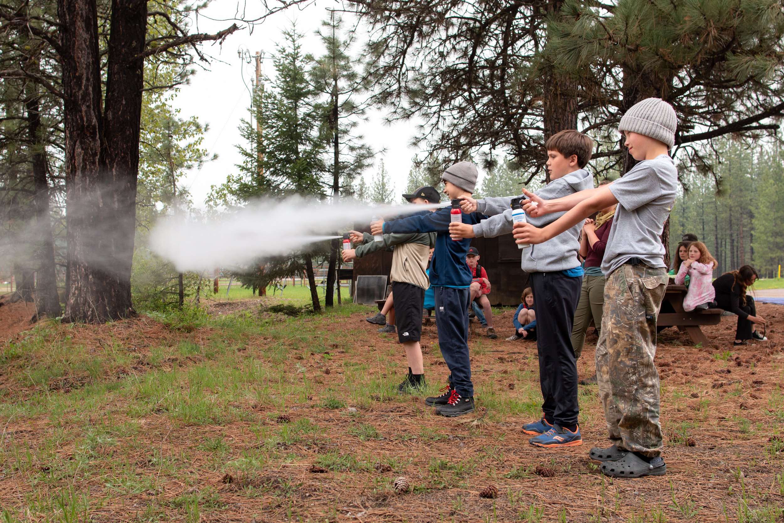  Bigfork Elementary students practicing with inert bear spray cans 