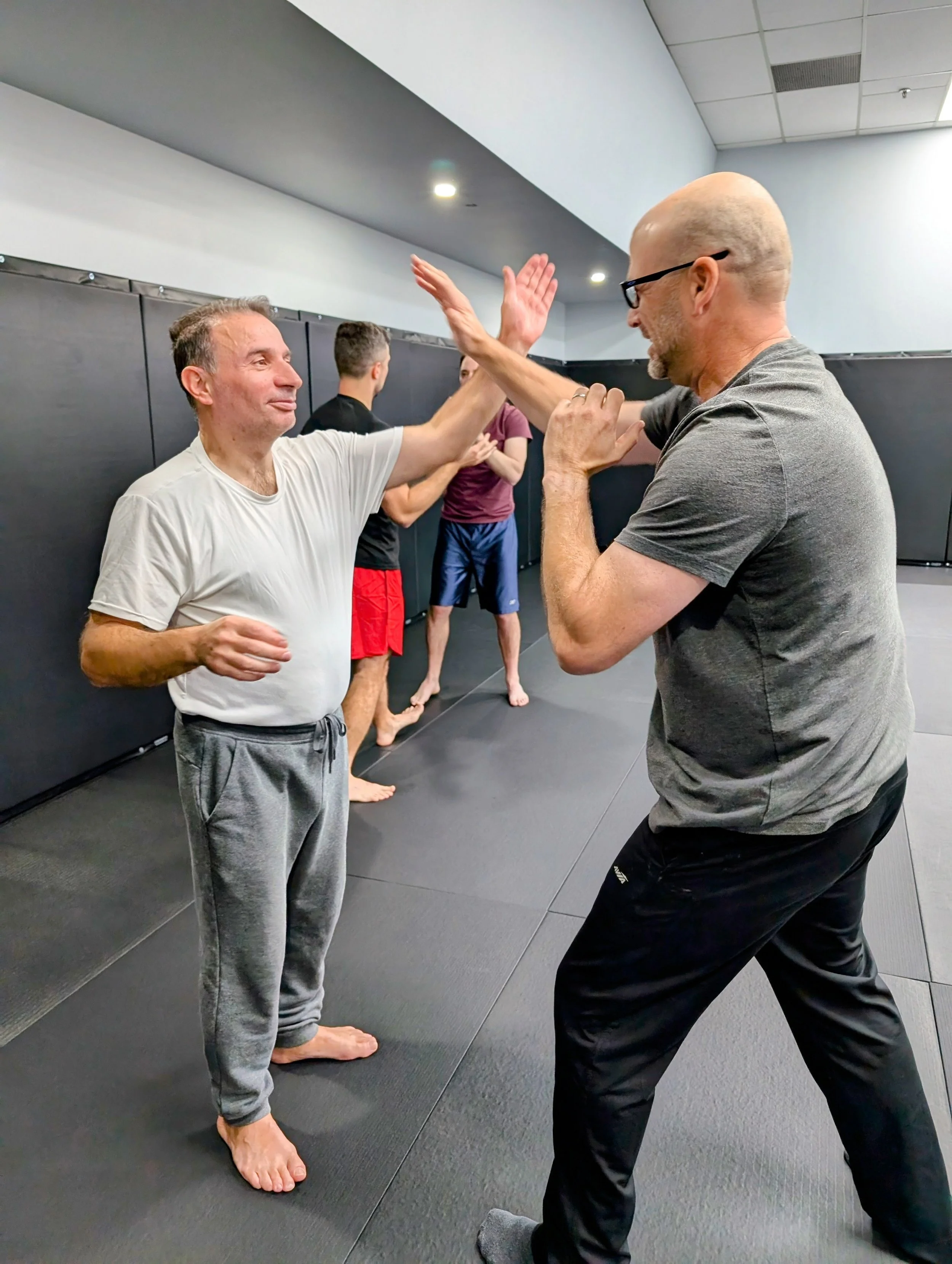 Men practicing Krav Maga self-defence drills near Bathurst and Sheppard