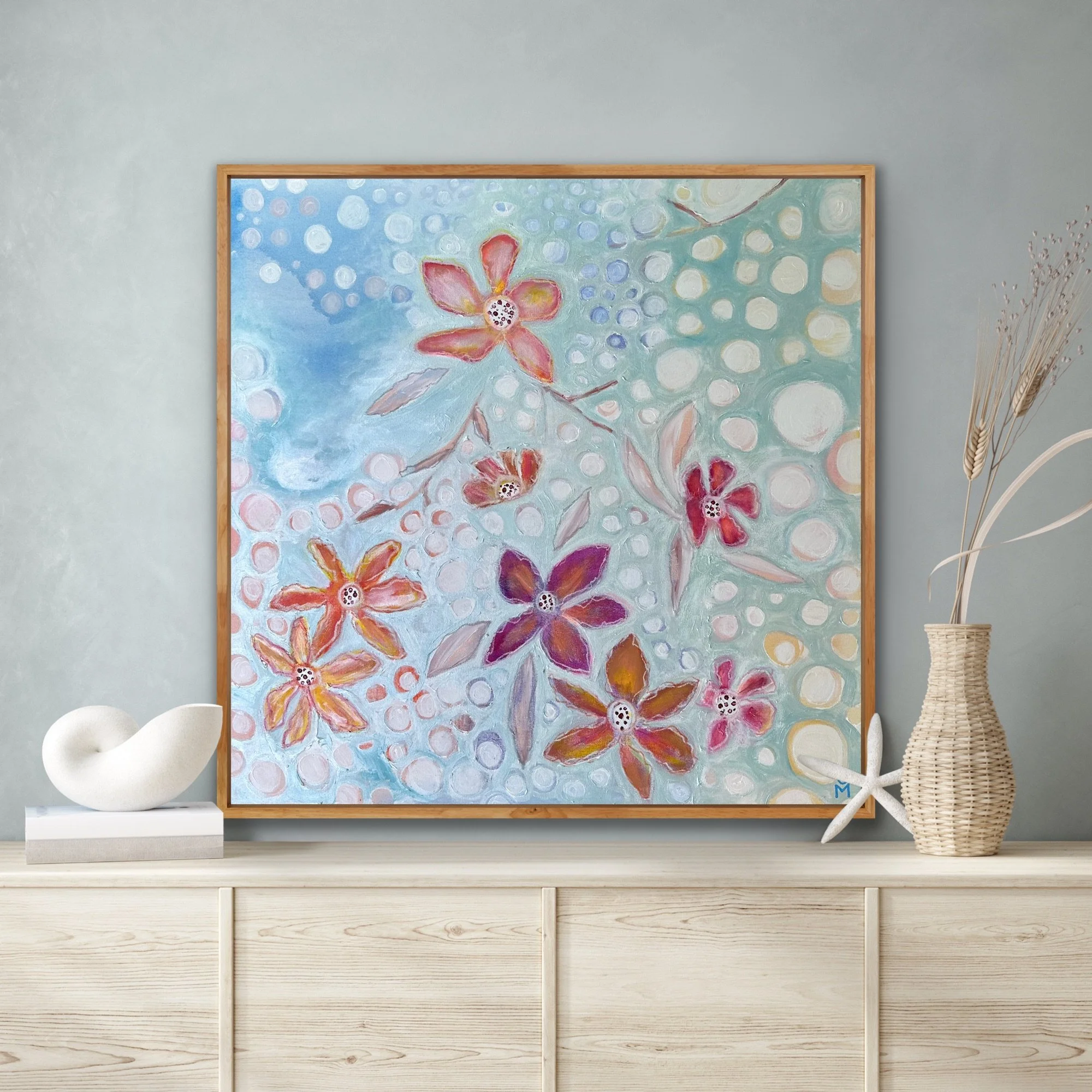 Pearl Blue Breeze is an artwork with magnolias attached by a branch. The flowers hover over a pearl blue background