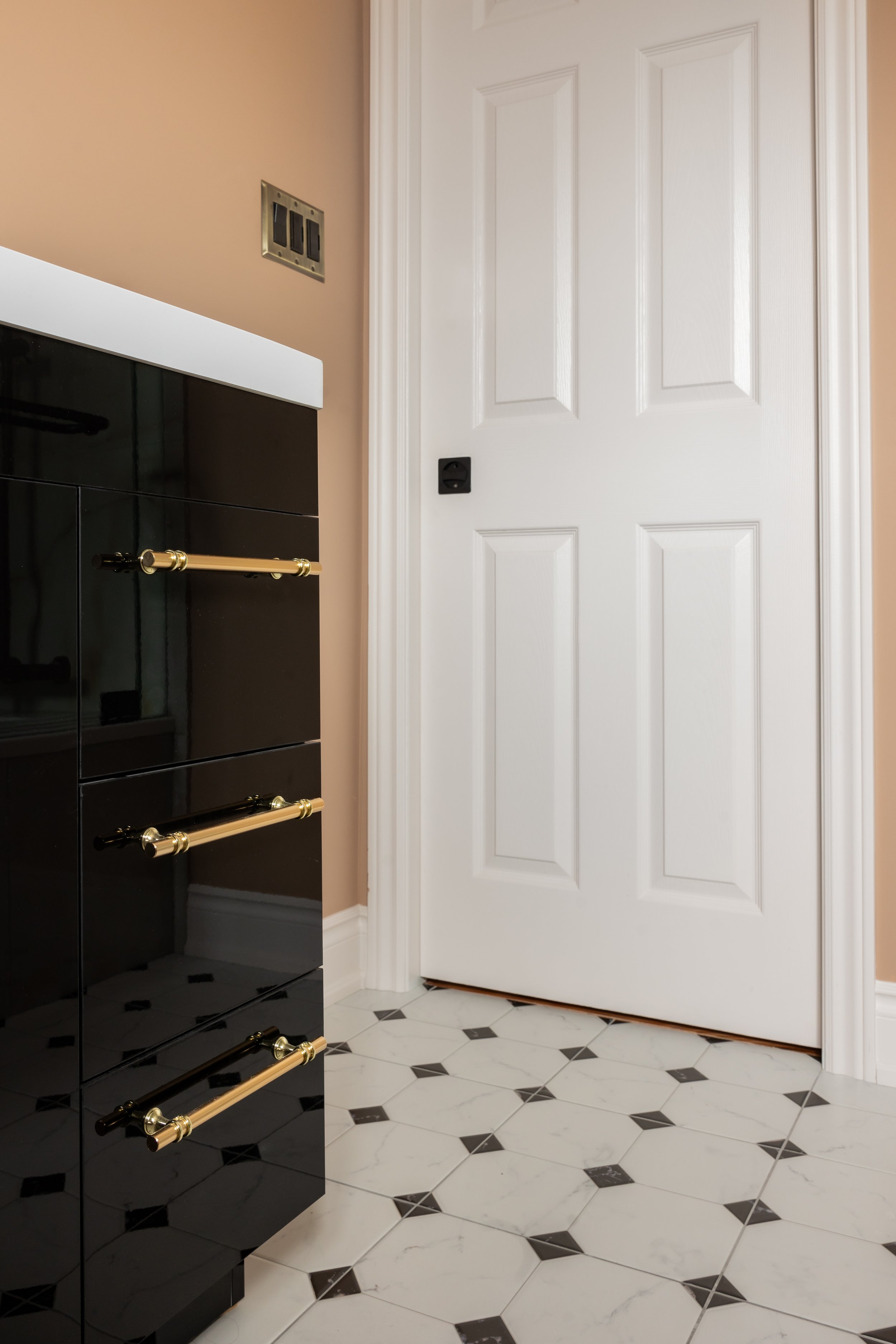 Washroom black and gold vanity - pocket door