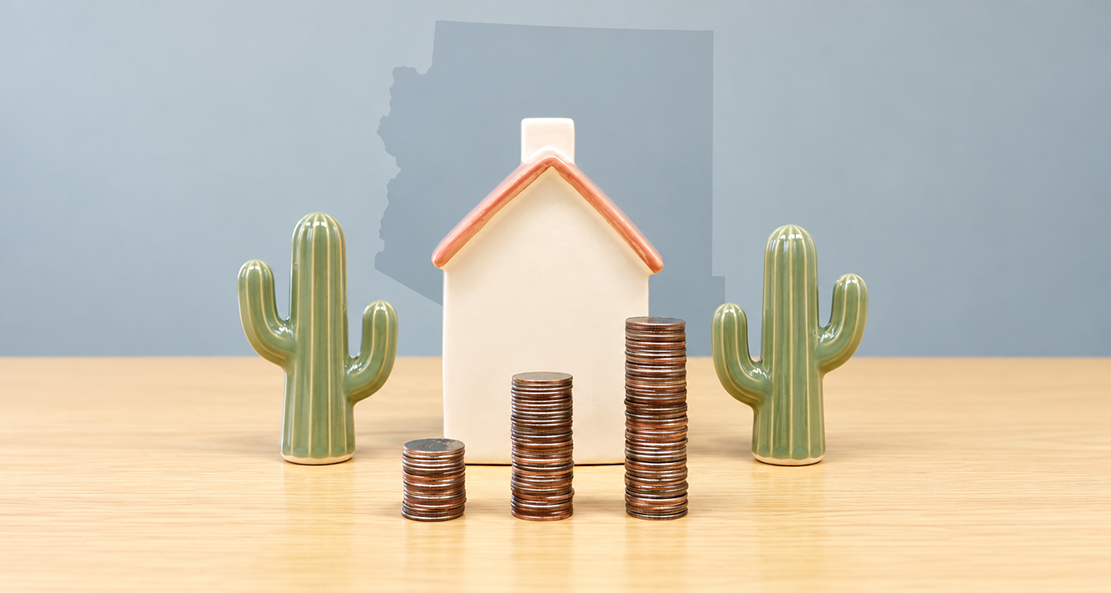 A ceramic house surrounded by coins and cactus sits before an outline of Arizona state.