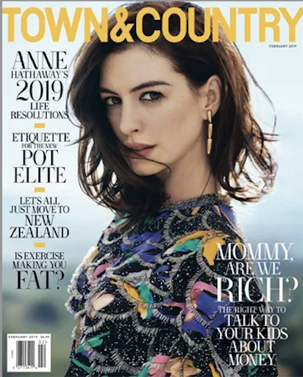 A woman with brown hair wearing a colorful, patterned top and gold earrings on the cover of Town & Country magazine, February 2019.
