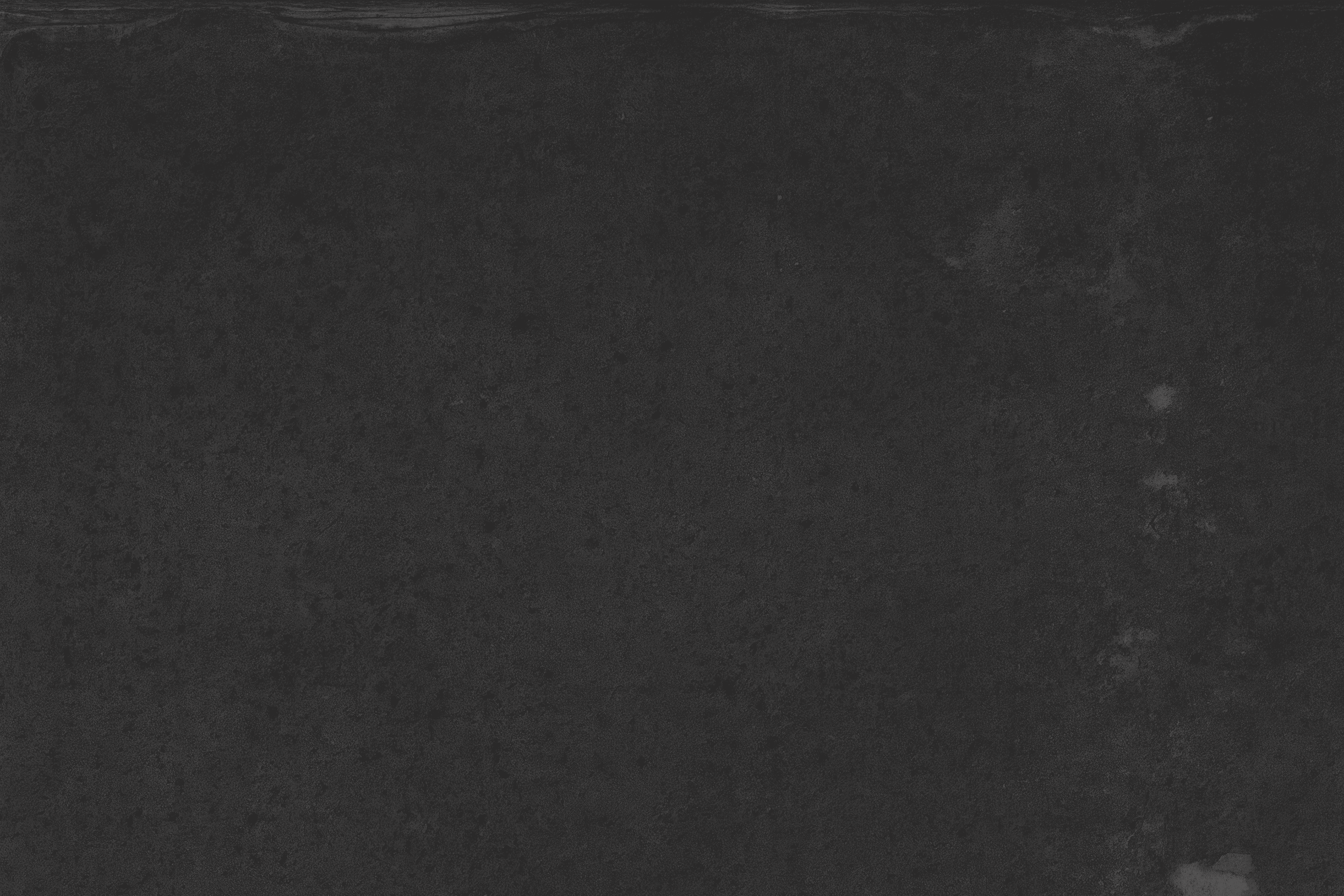 Empty black chalkboard with a slightly textured surface.