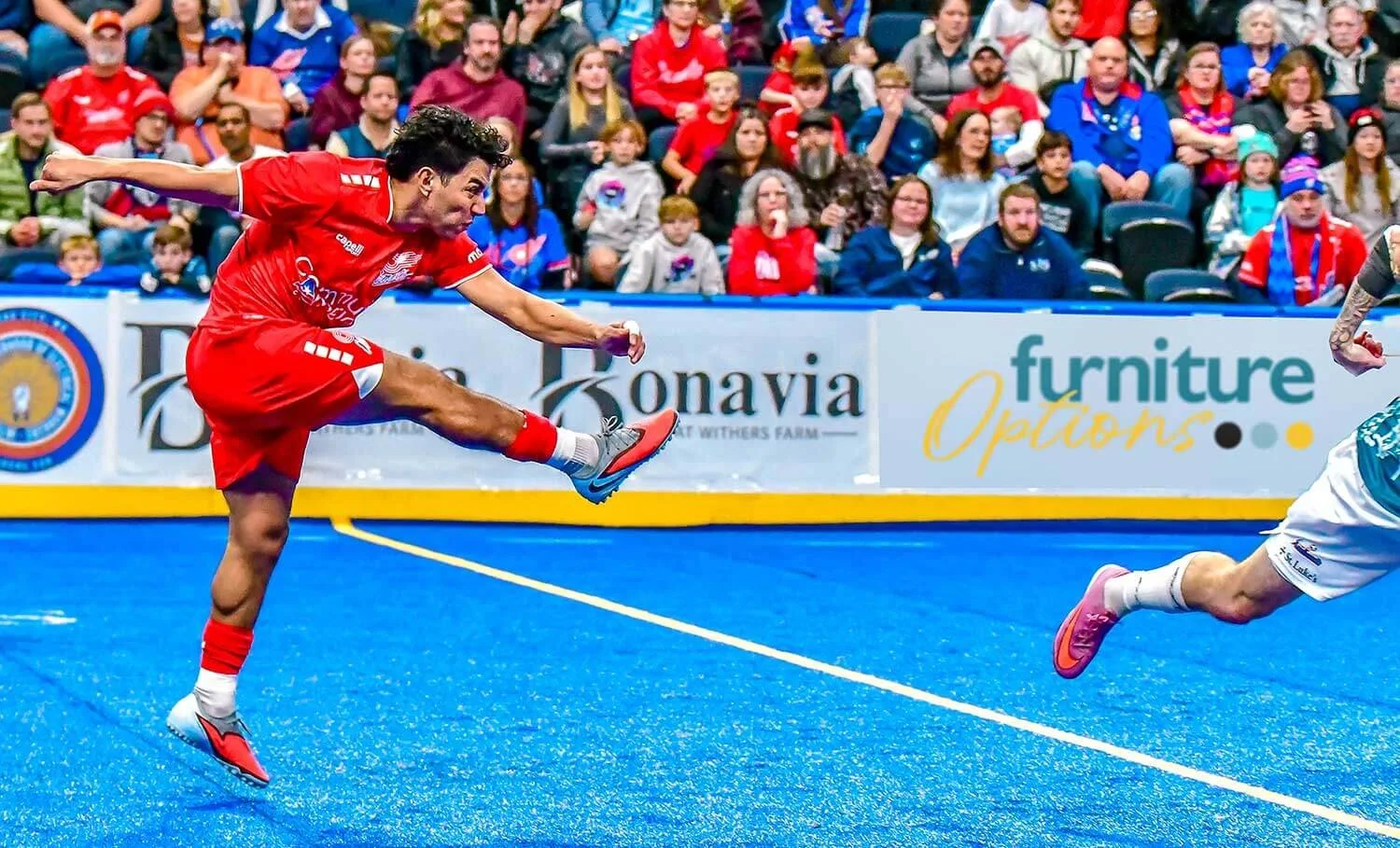 KC Comets with Furniture Options sign in the background