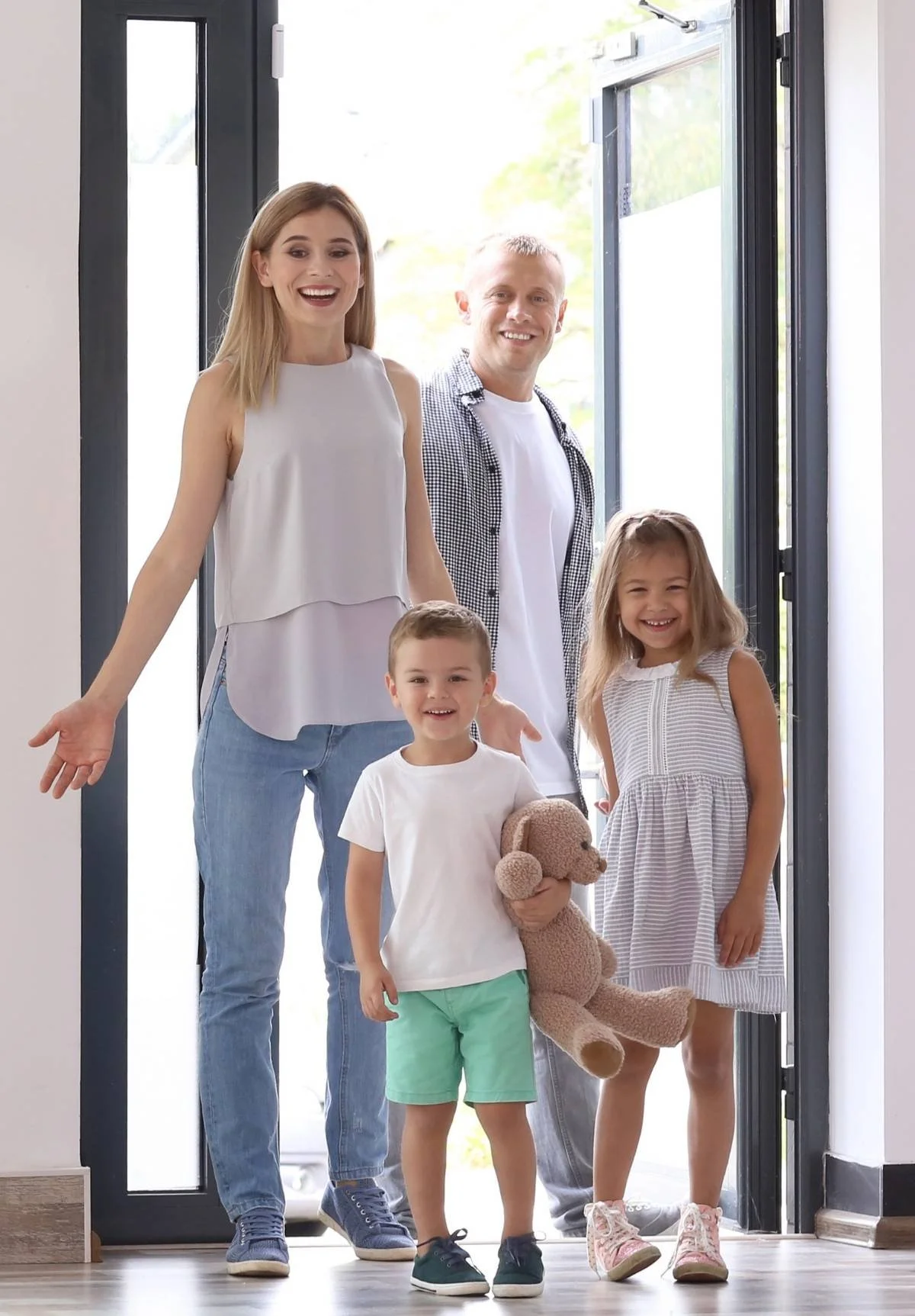 Relocation family walking into their new home and seeing new rental furniture from Furniture Options