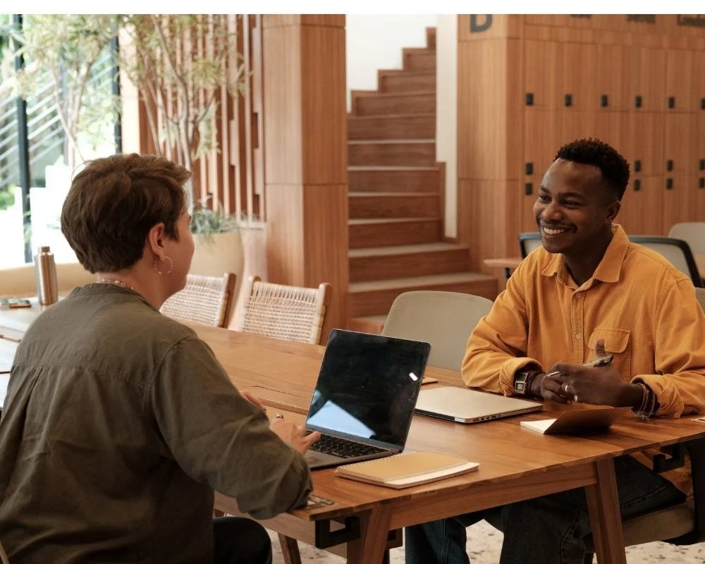 HR professional interviewing an employee getting ready for relocation.
