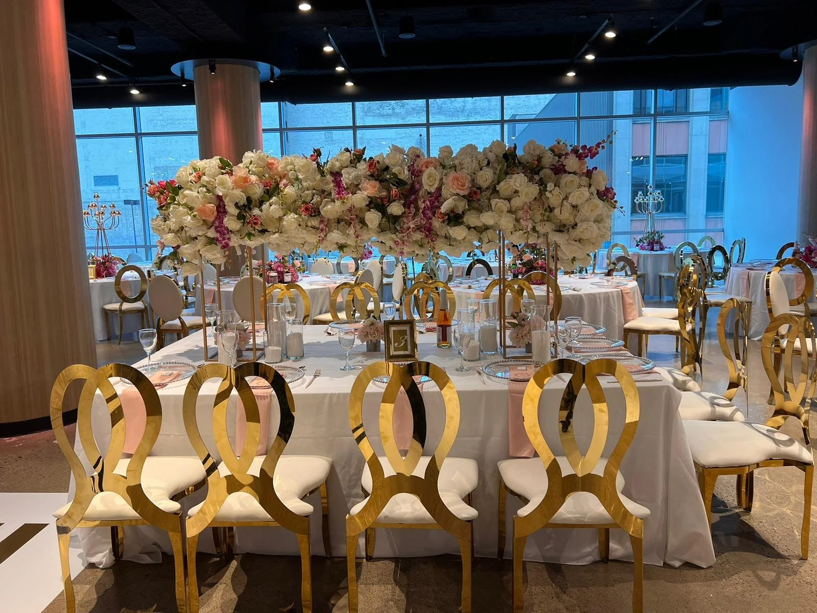 luxurious wedding table tall floral gold chairs.jpg