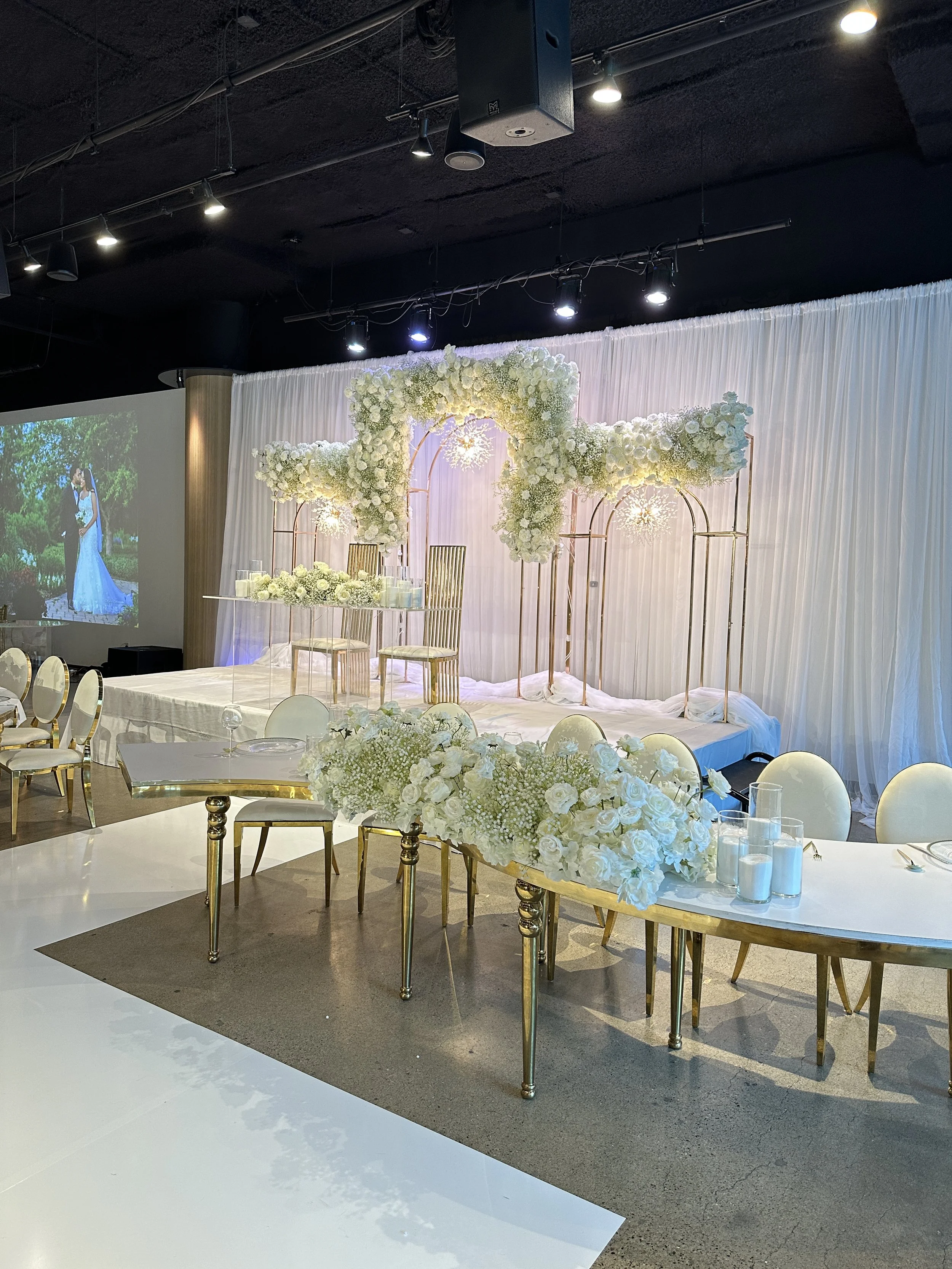 White Themed Wedding Bride Groom Seating Stage White Floral.JPG