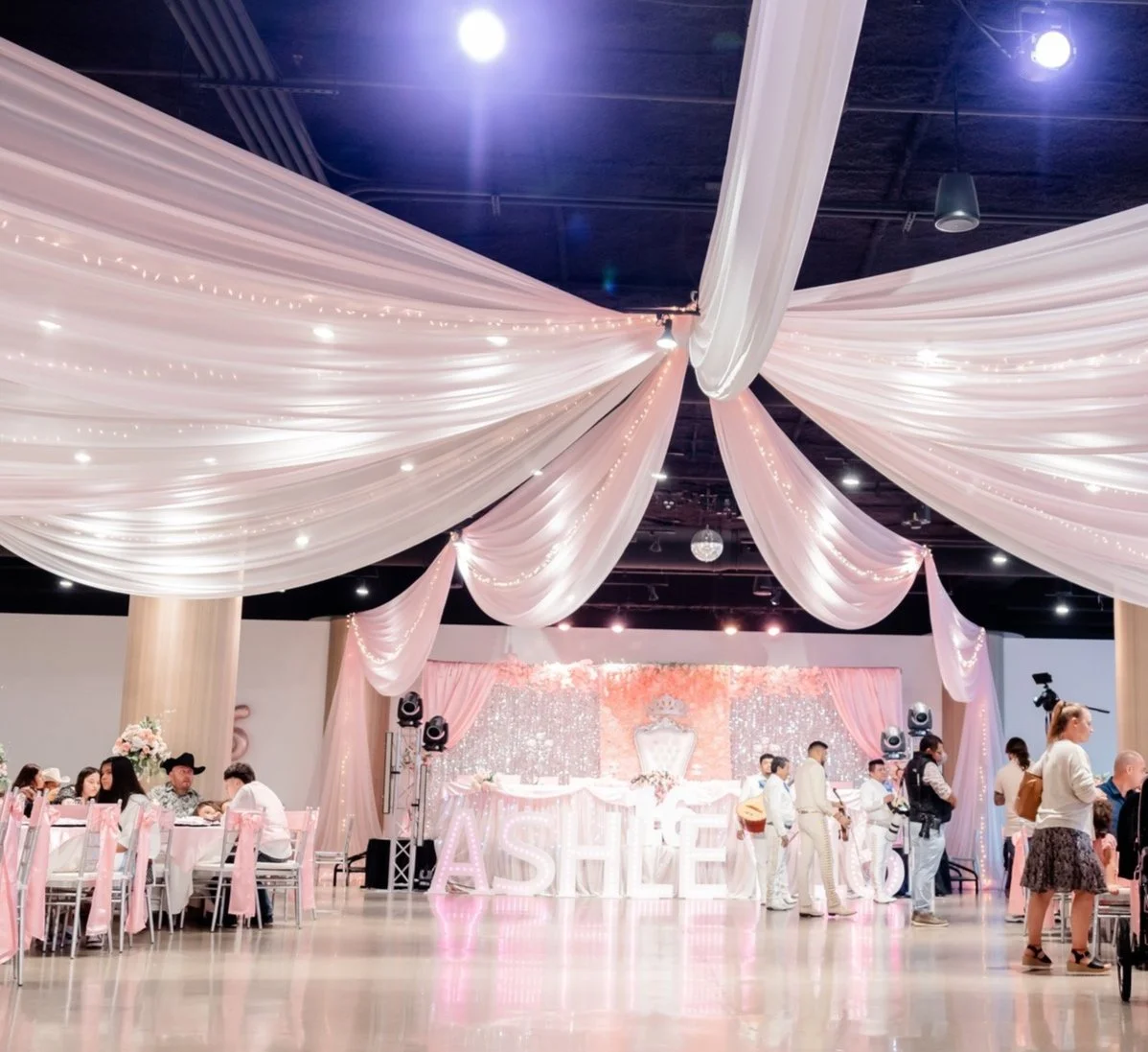 quinceanera-setup-pink-draping-floral-centerpieces-sparkly-stage-st-paul-event-center.jpg