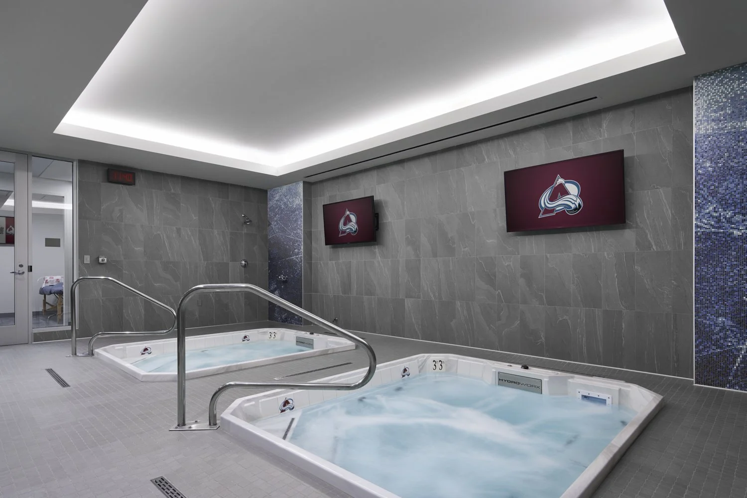 Interior image by architectural photographer Brad Nicol Photography of the Colorado NHL Avalanche professional hockey team in training and recovery sports medicine room.