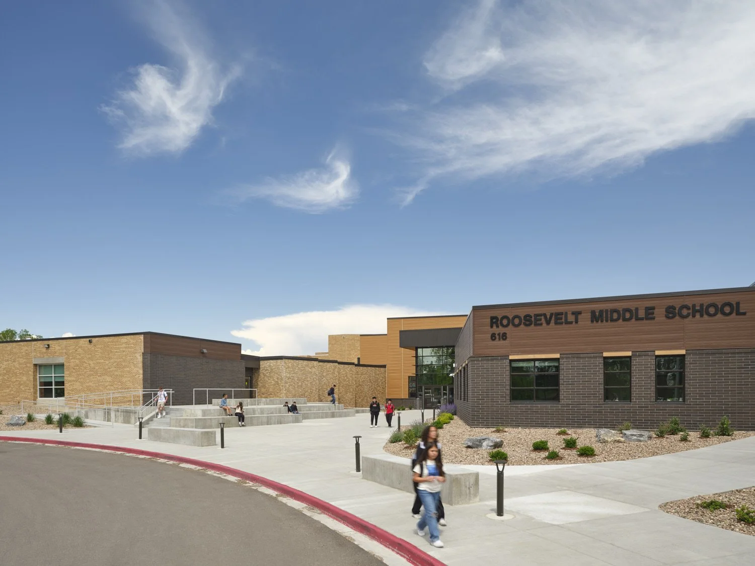 Exterior image of a middle school and high school educational building in Colorado for an architect by architectural professional photographer Brad Nicol Photography