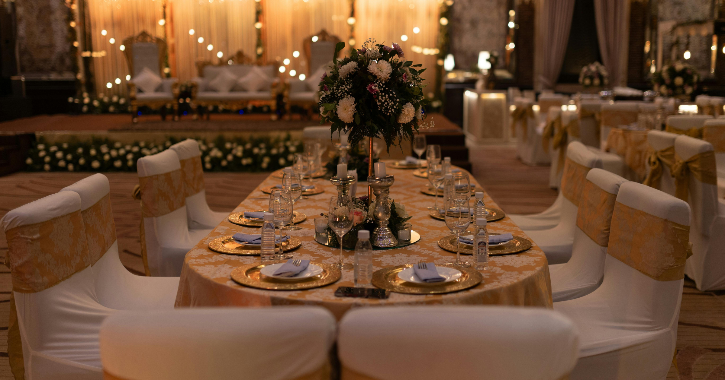 Tablescape with bespoke event installations influenced by hospitality design principles