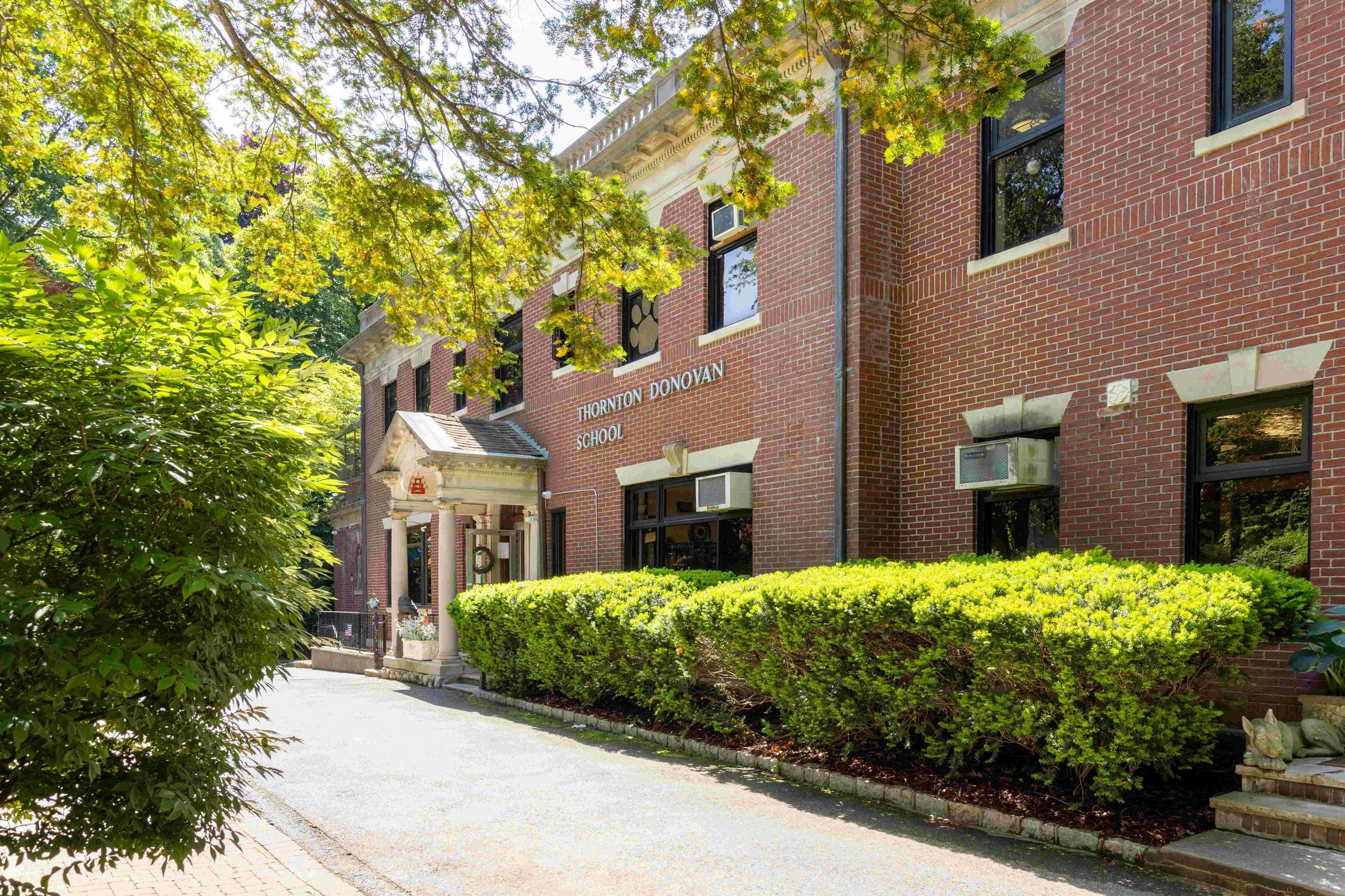 Exterior of Thornton Donovan School main and largest building on campus where Berns Memorial Library, Freedom Hall, and a majority of classrooms and offices are located.