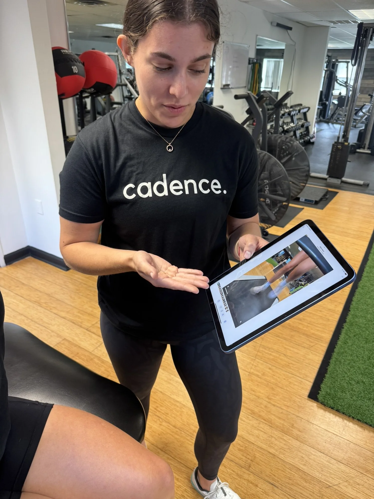 Cadence physical therapist reviewing running mechanics with a patient