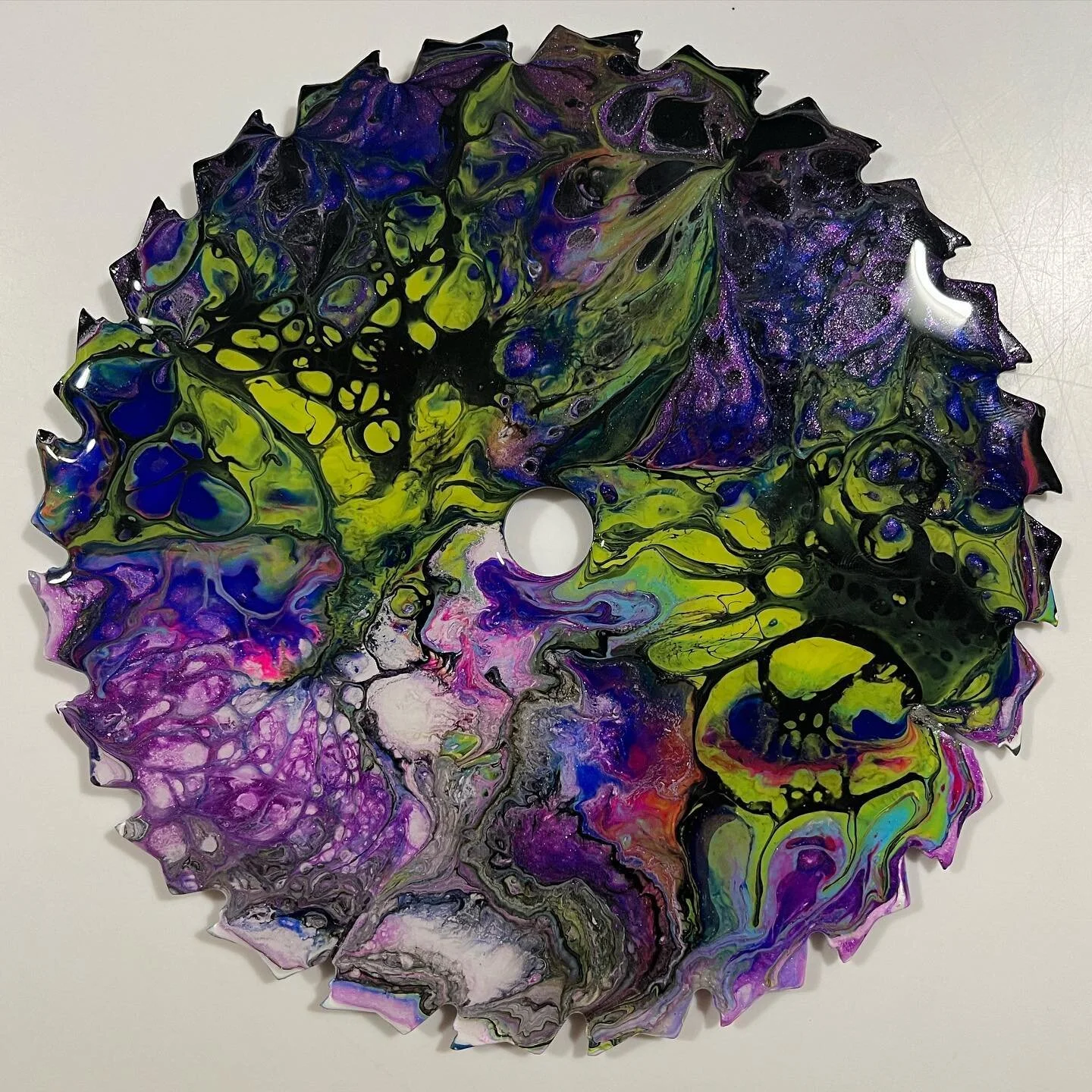 The colours out of space👽🛸🧬

Acrylic on 7&rdquo; sawblade 
.
.
.
.
.
.
.
#acrylicpainting #sawblade #art #fluidart #acrylicpouring #resinart #fluid #space #fungi #spore #nature #green #camo #natureart #spiral #yvrart #lovecraft #viral #spaceart #l