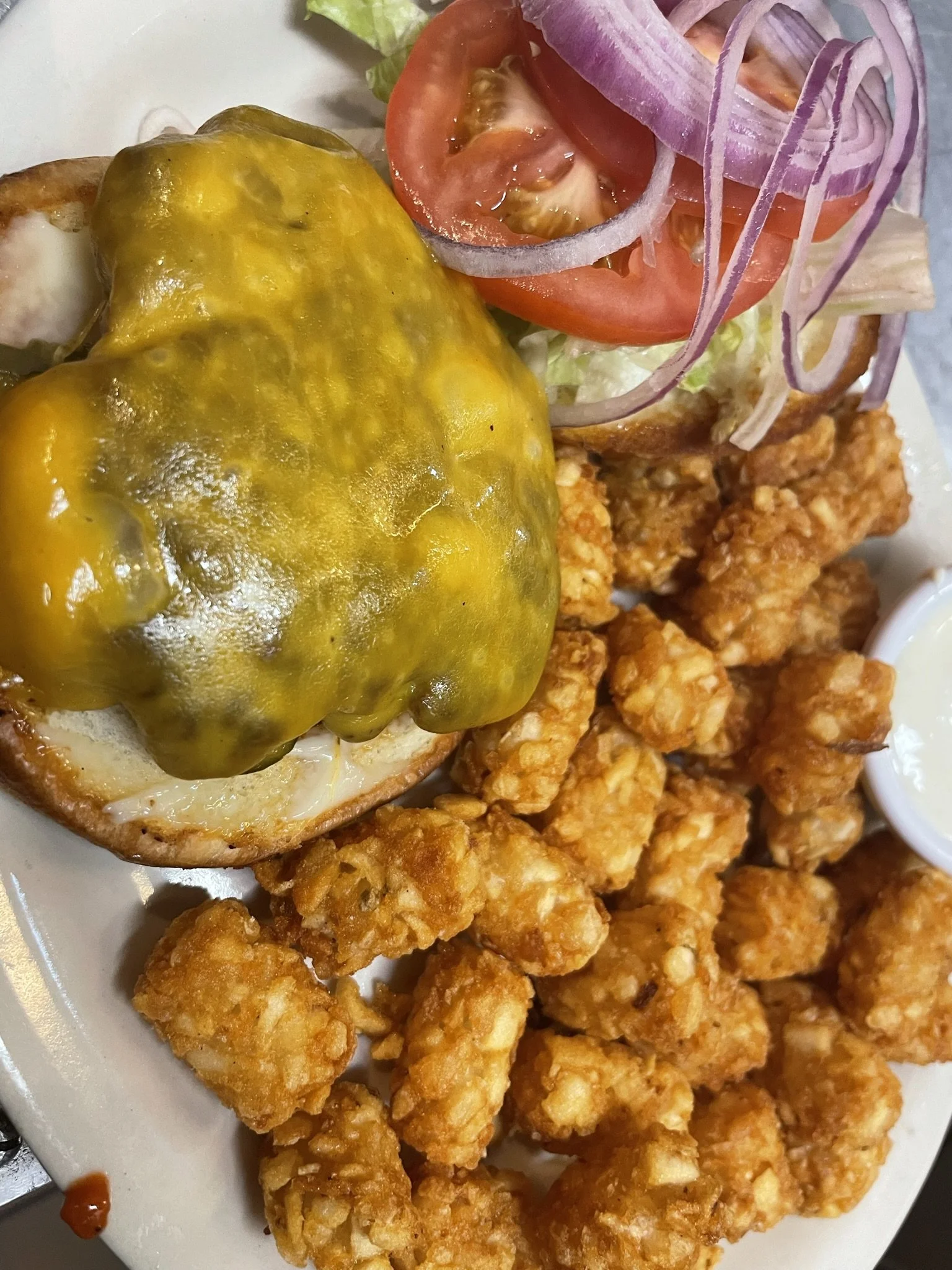 Cloverleaf Sports Bar & Grill Cheeseburger and Tots.jpeg