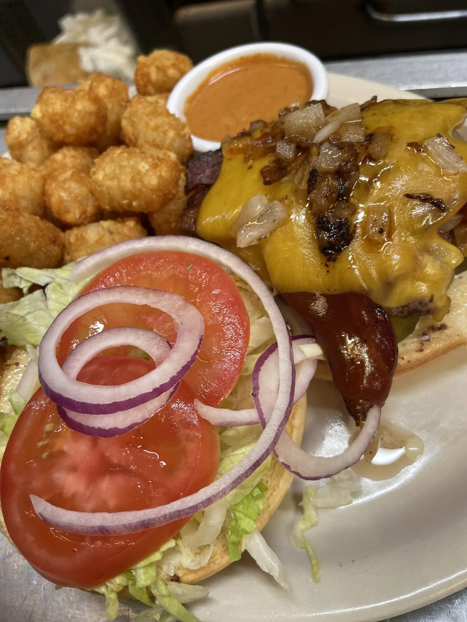 Cloverleaf Sports Bar & Grill Burger & Tots with sauce.jpeg