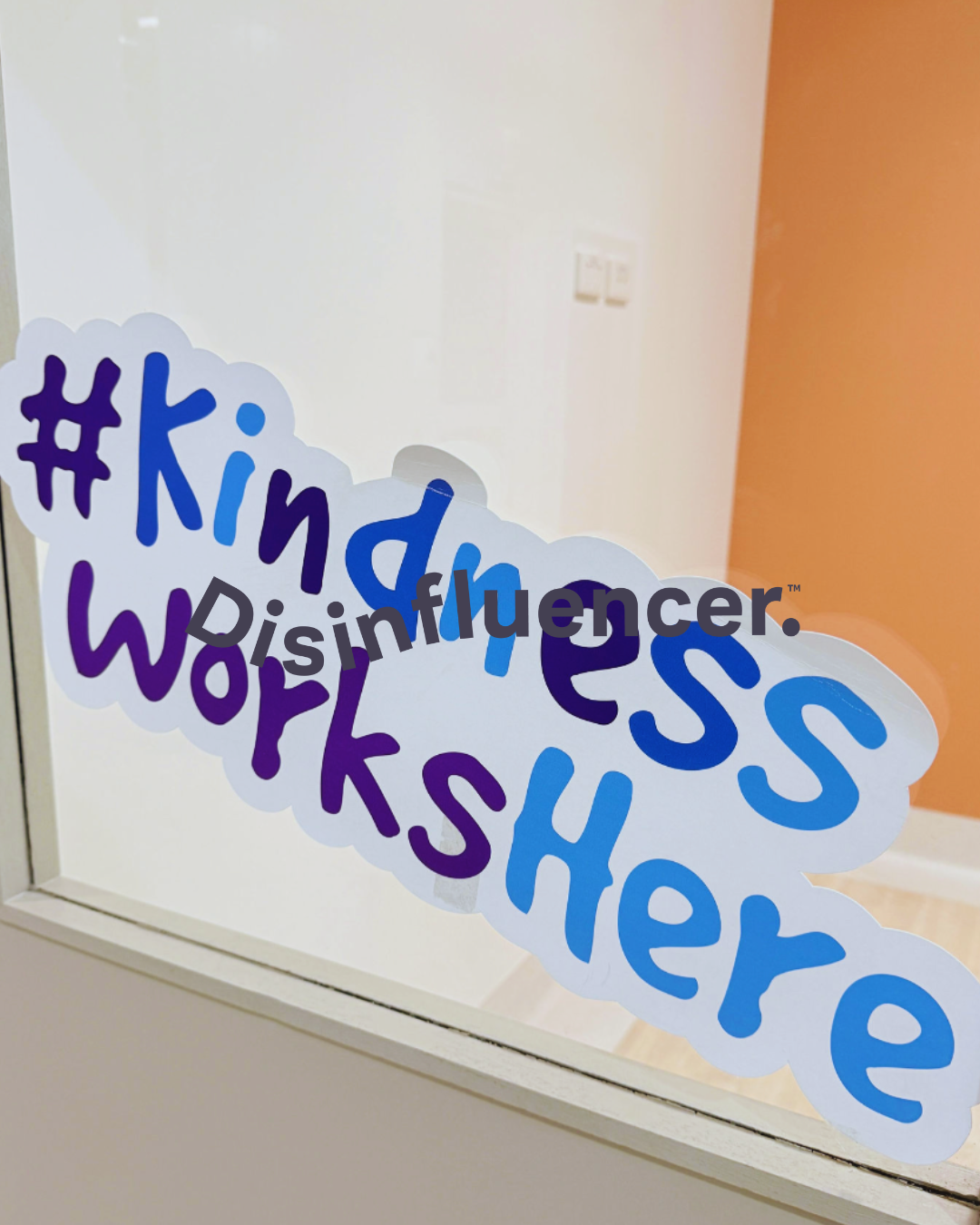 A photo of an office with the words #KindnessWorksHere from our RAW - Objects and Things category in the disinfluencer inclusive stock library.