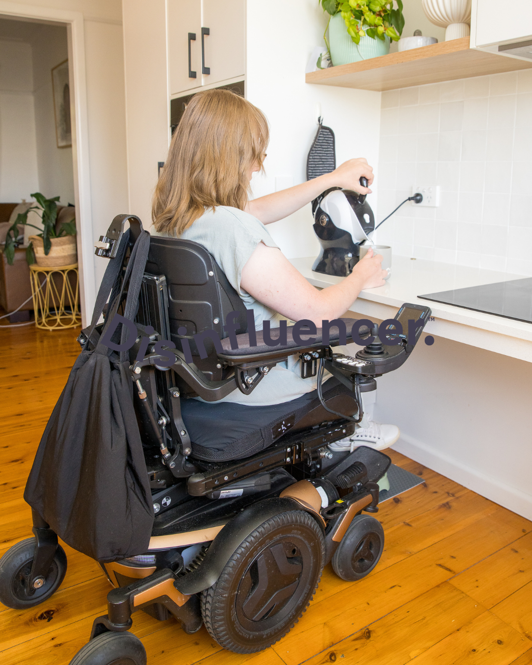 Ellie, making a cuppa with her Accessible Kettle.