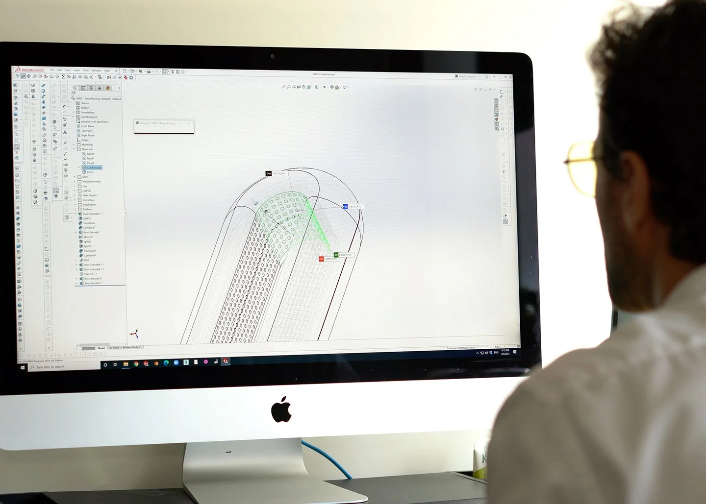Engineer reviewing a 3D CAD model
