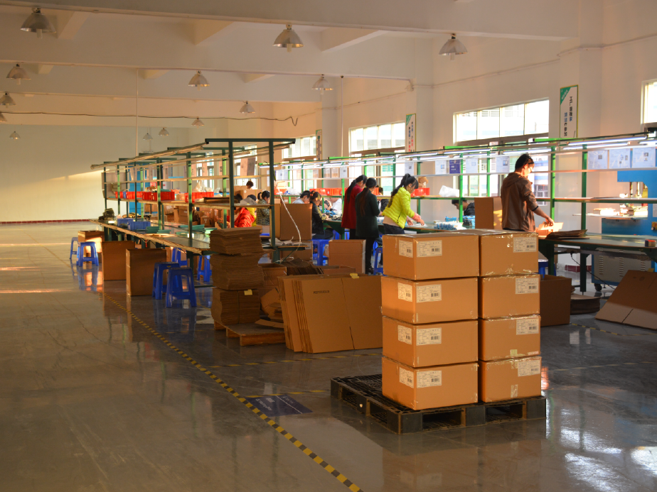 Manufacturing workspace with packaged products and quality control operations