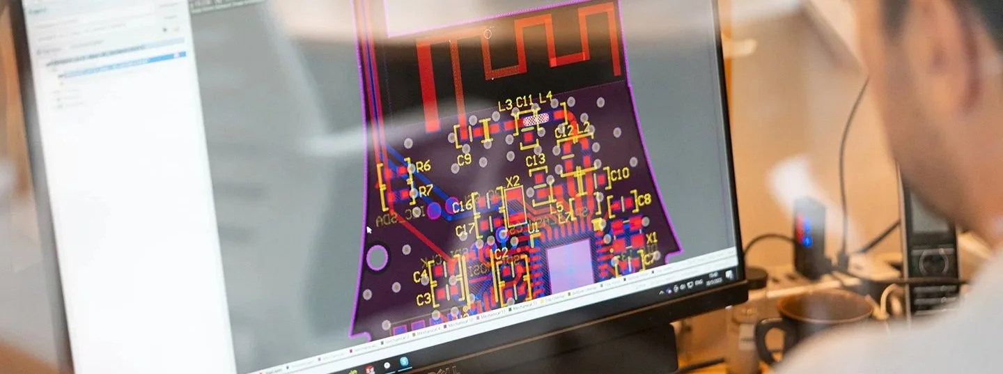 Custom firmware development and PCB design on computer
