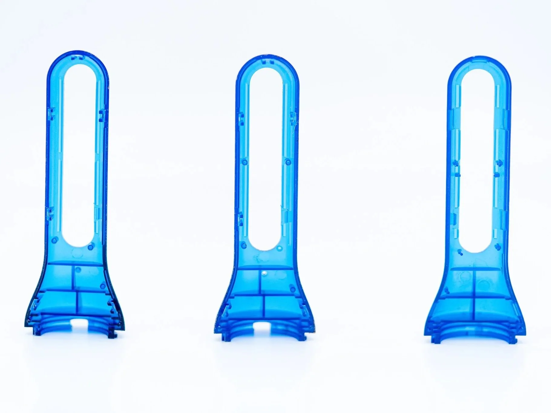 Blue transparent prototype designs showing product form and fit iterations
