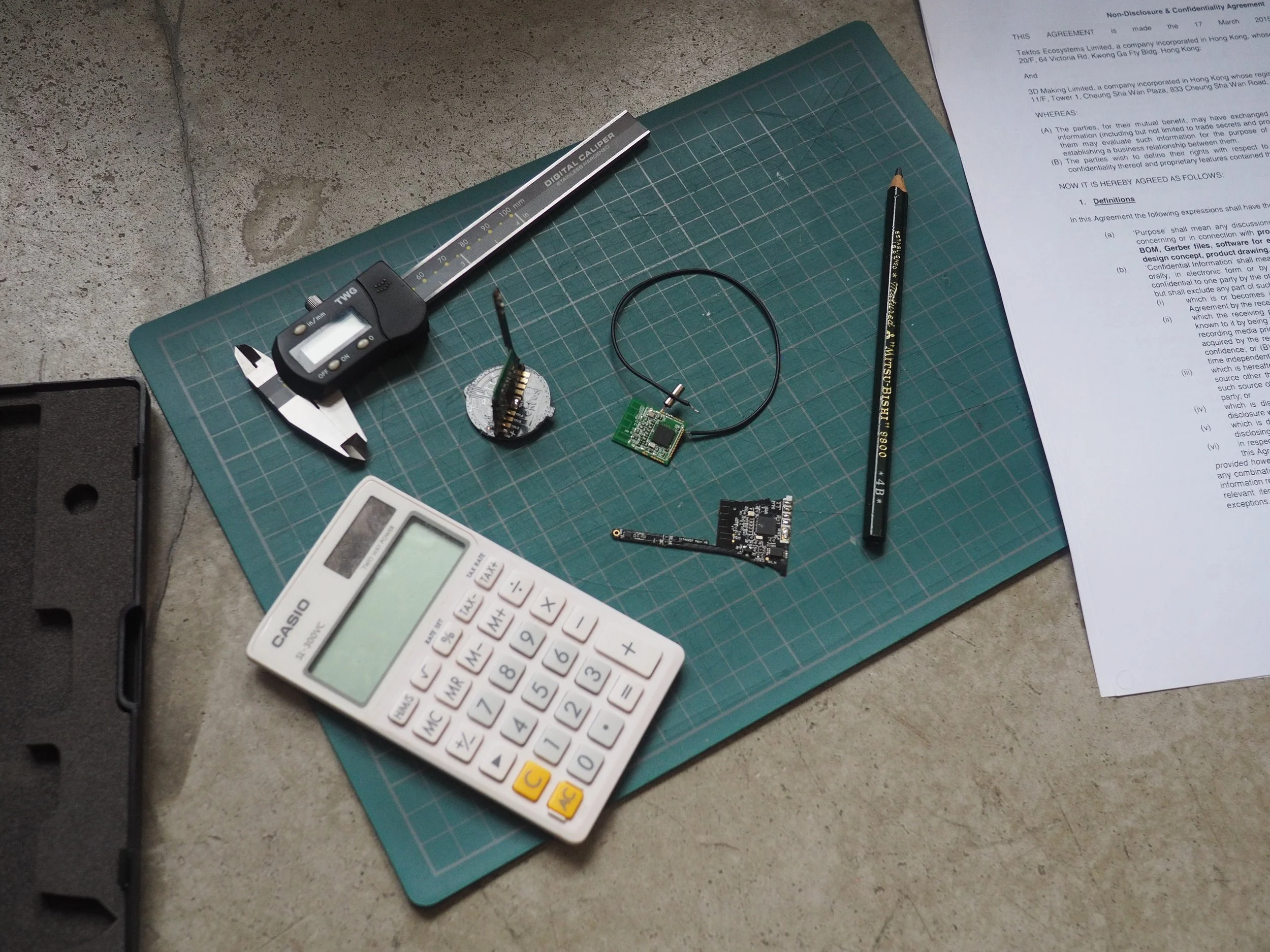 Product design tools and feasibility assessment materials on workspace