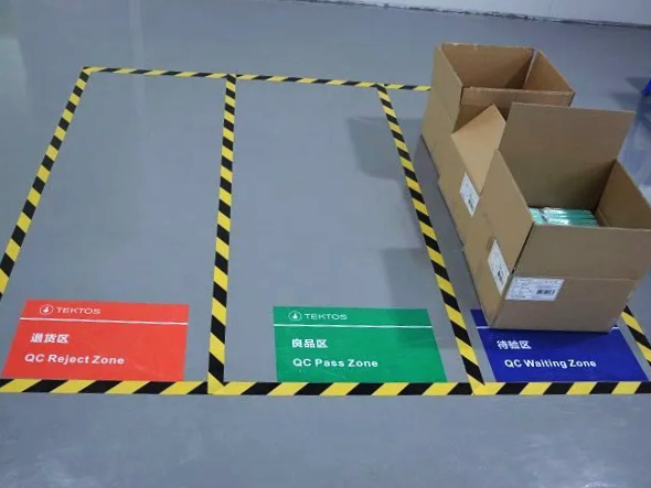 Manufacturing setup zones with safety markings for quality control and production flow