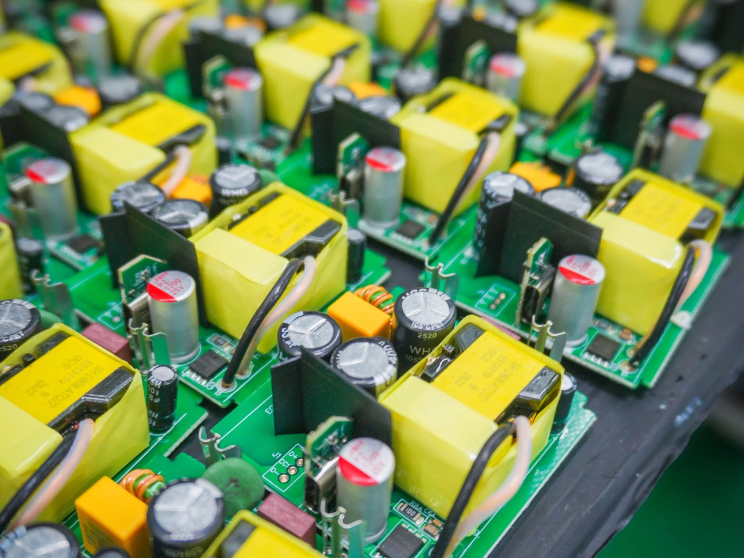 Mass production of electronic circuit boards on manufacturing assembly line