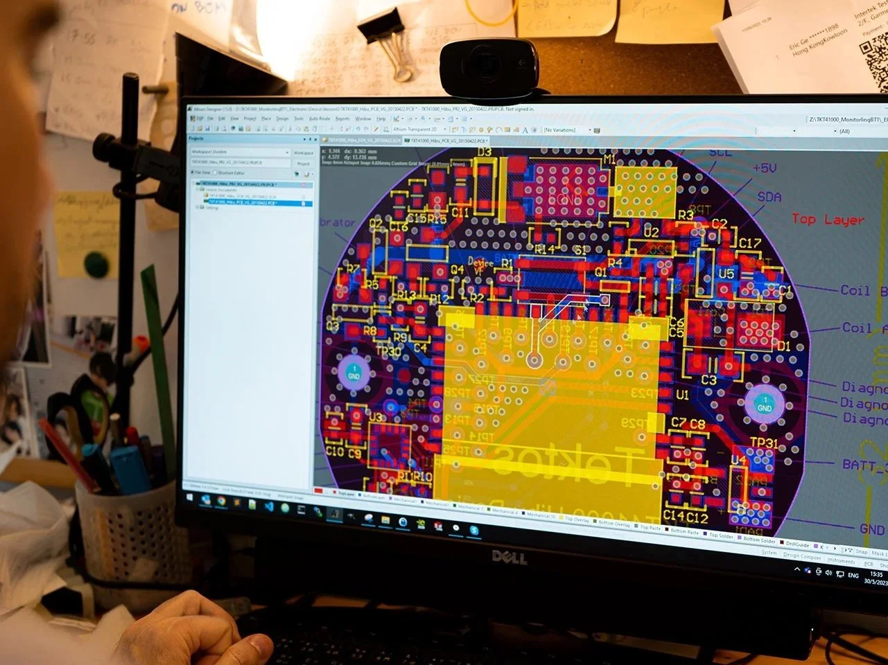 PCB layout design on computer screen showing component placement and routing