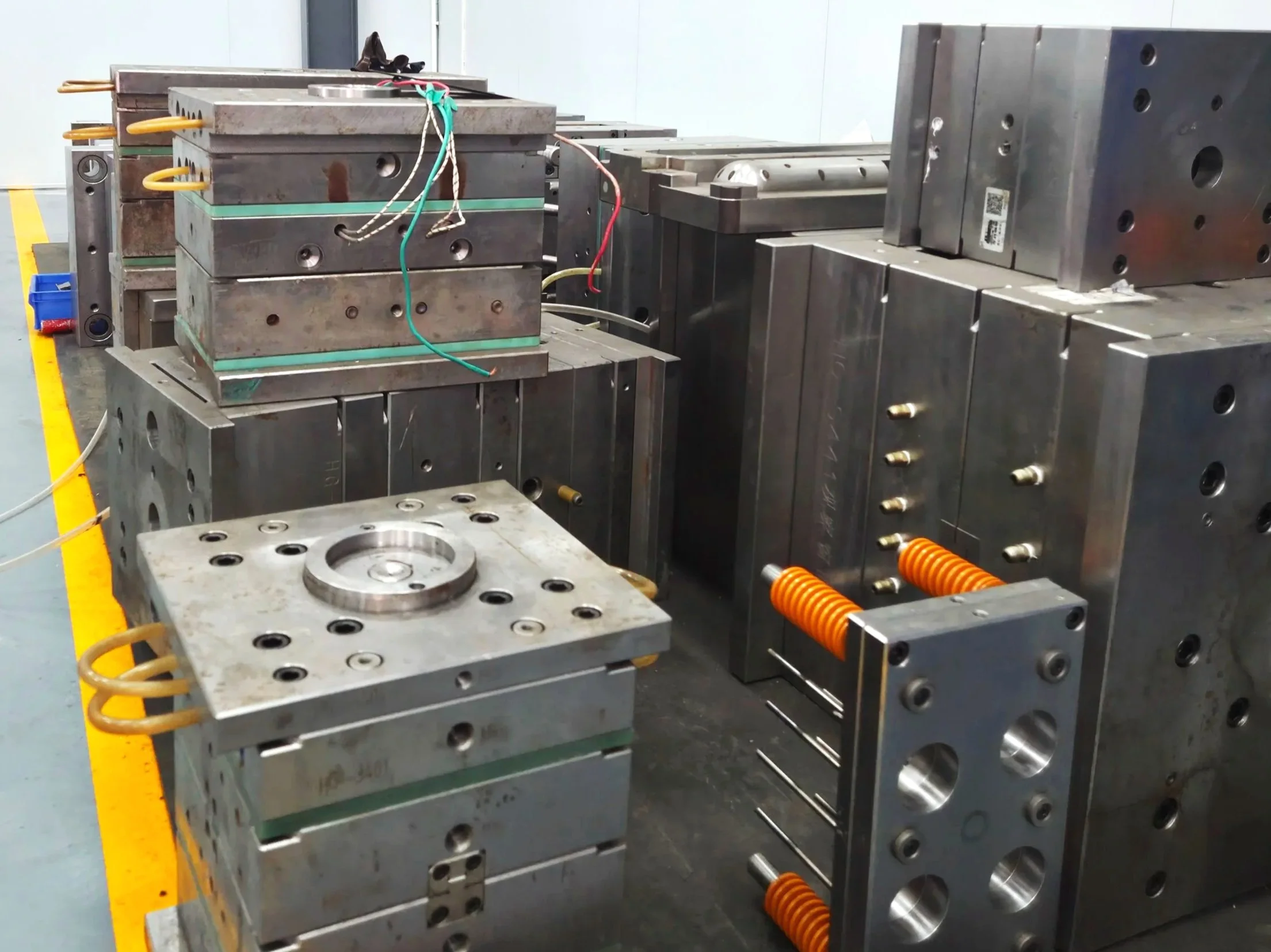 Industrial mold tooling equipment and dies in manufacturing facility workspace
