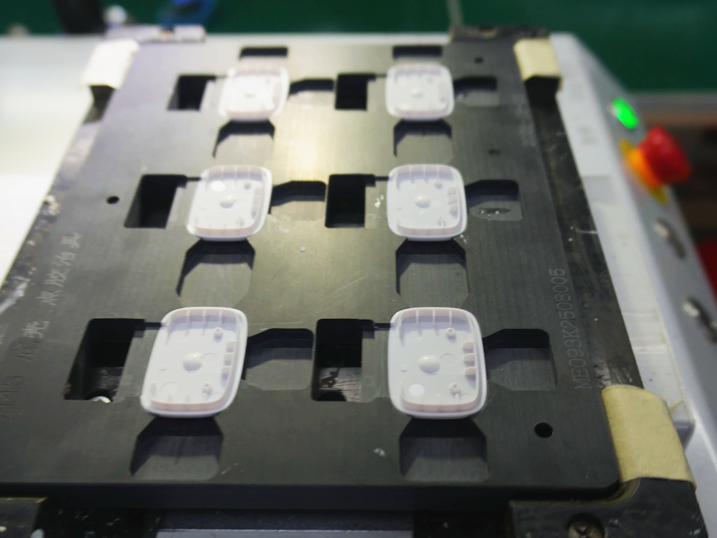 Custom manufacturing fixture with precision cutouts for mechanical assembly process