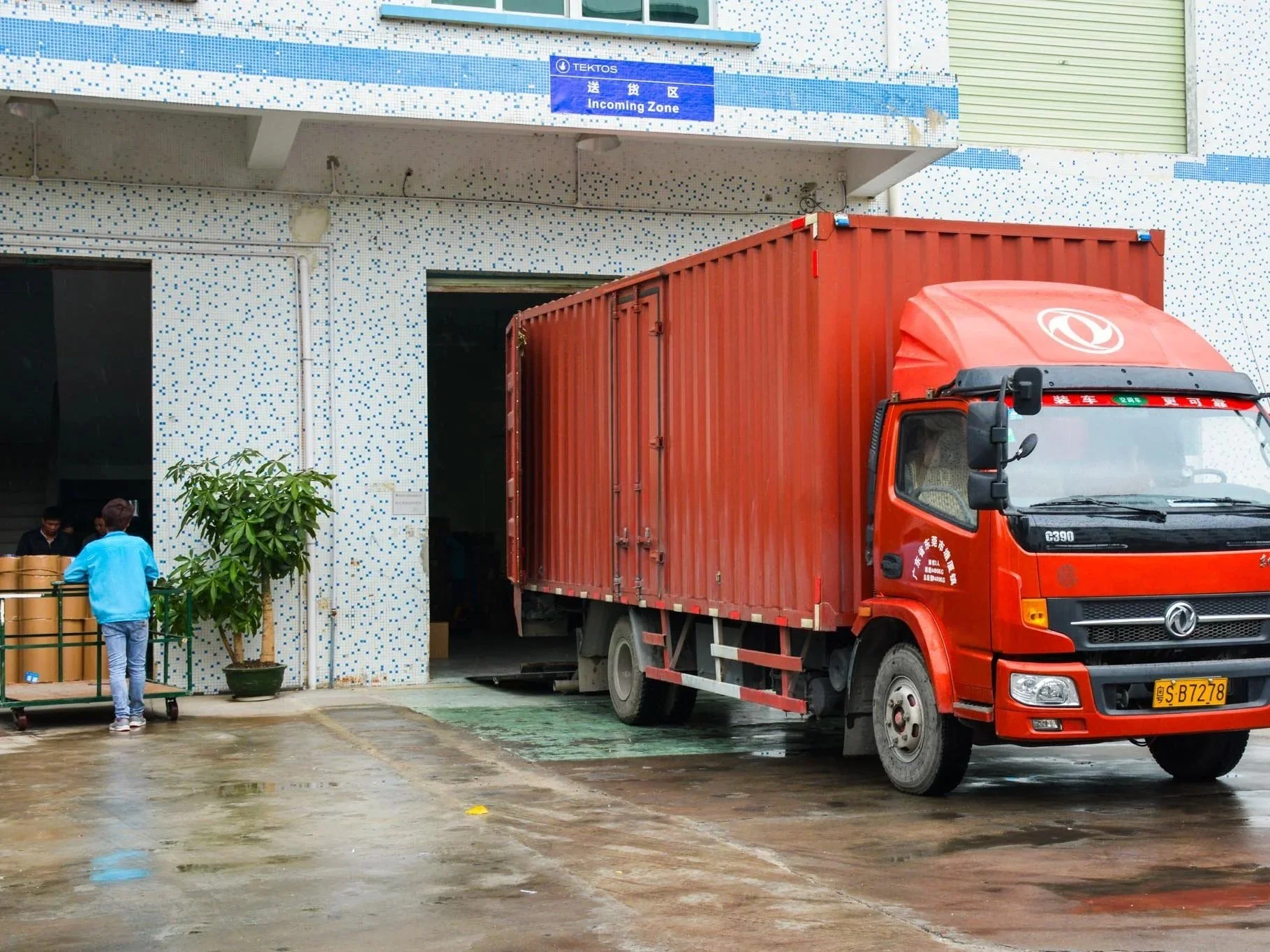 Logistics truck at manufacturing facility for modular product distribution