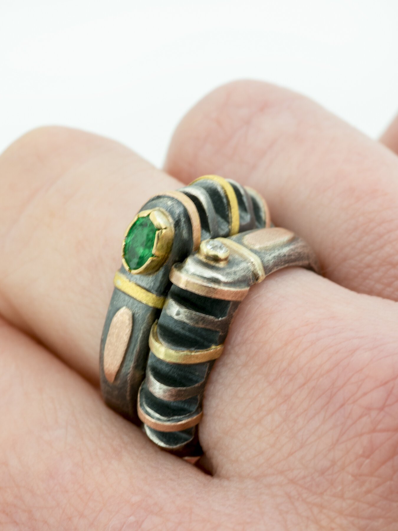 Cut Ring with Emerald Stack on hand.jpg