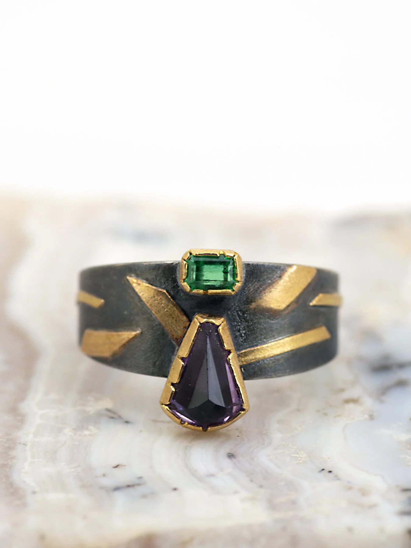 Amethyst and Emerald on a tapered round ring 1.jpg
