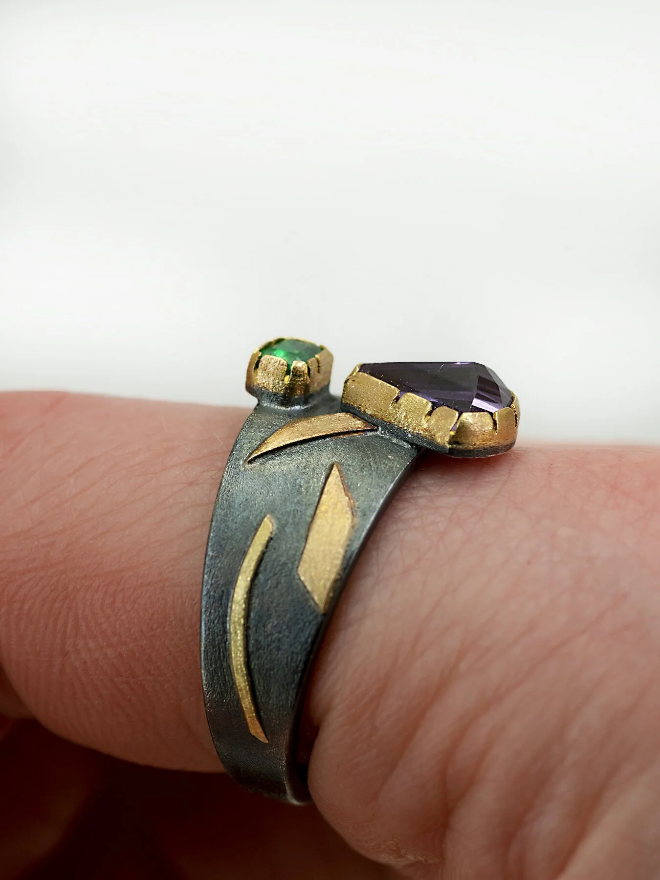 Amethyst and Emerald on a tapered round ring on 3.jpg