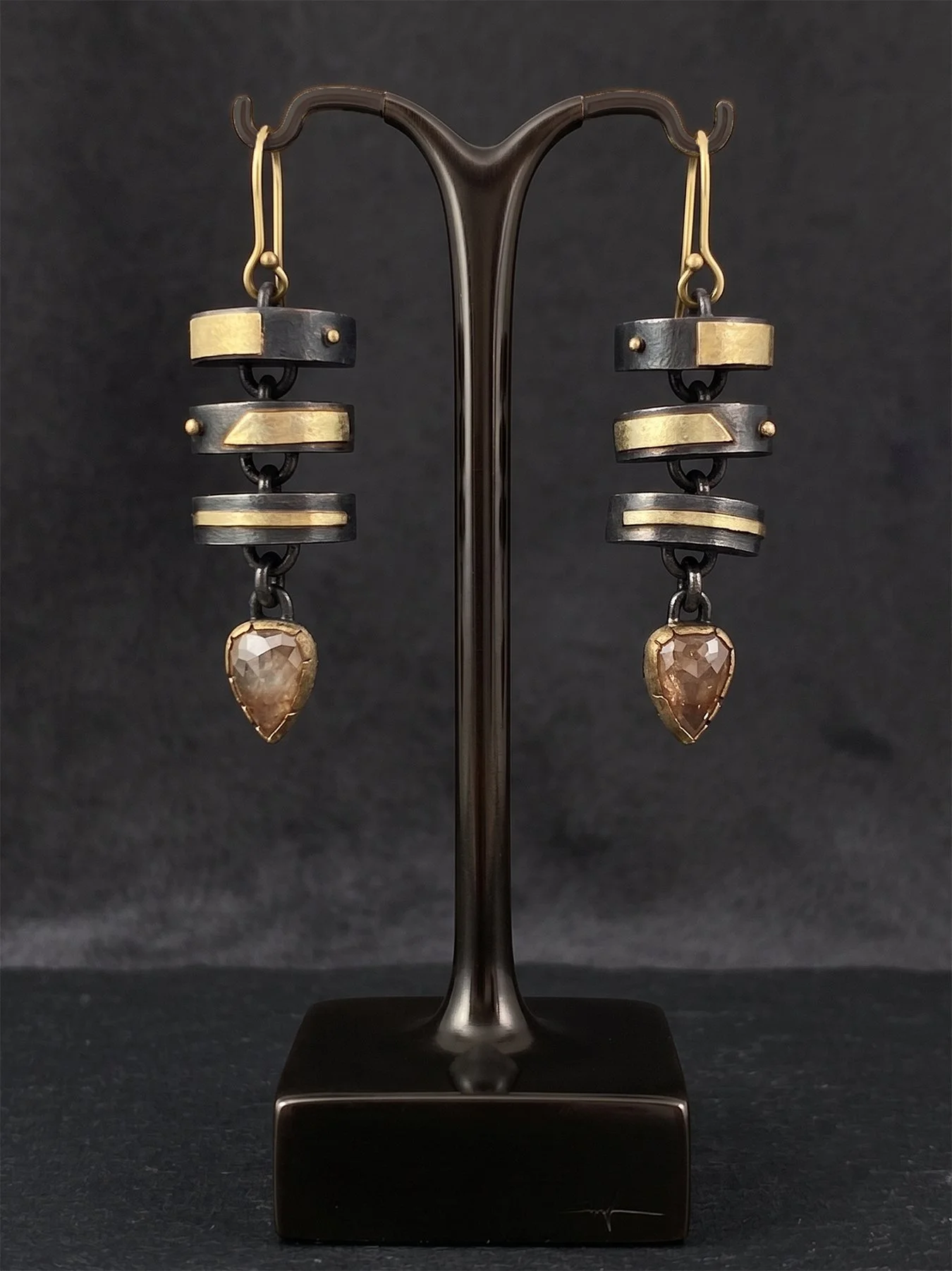 Triple Unit Earrings with Orange Diamonds on dark holder.jpg