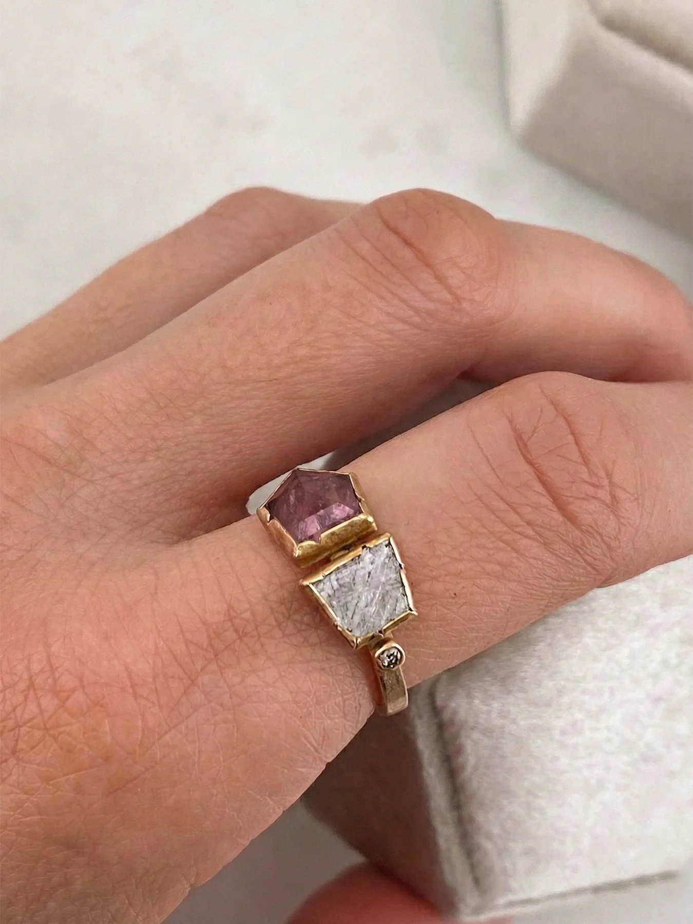 Meteorite, Diamond and Pink Tourmaline on a Rose Gold Ring on hand.jpg