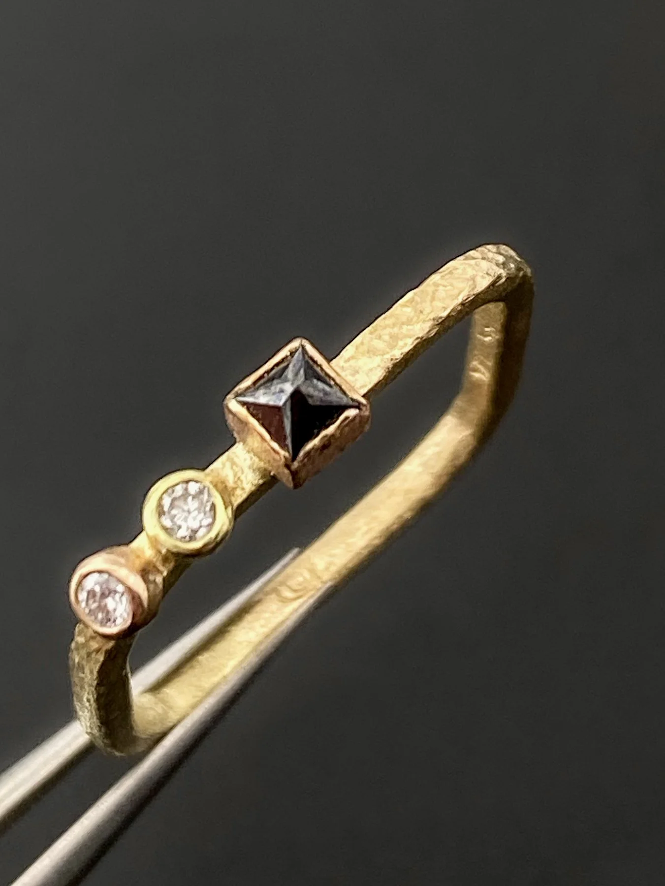 Square Black Diamond and Two Round White Diamonds on a Gradient Yellow-Rose Gold Square Band 5.jpg