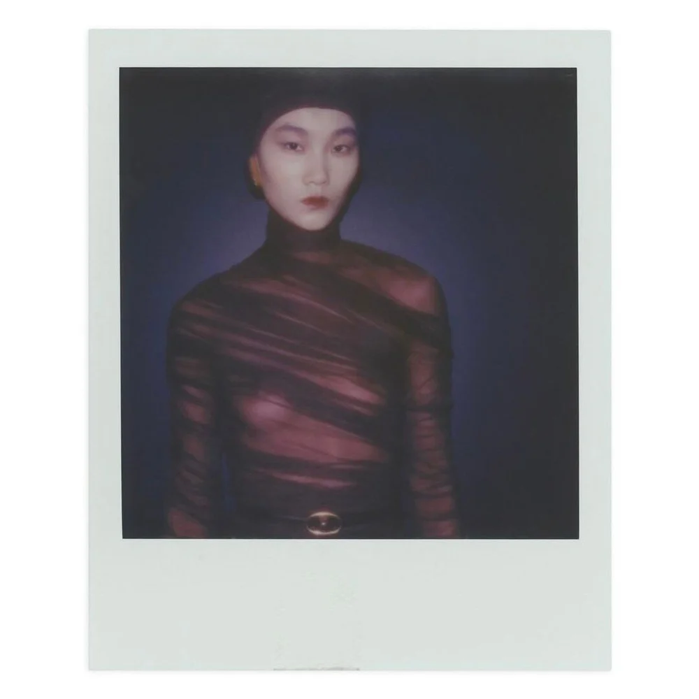 At the Saint Laurent Women's Winter 2024 show, Anthony Vaccarello redefines fashion's core essence by making garments disappear, leaving behind a subtle yet powerful allure. Close-fitting silk dresses evoke sheer undergarments, creating a hyper-graph