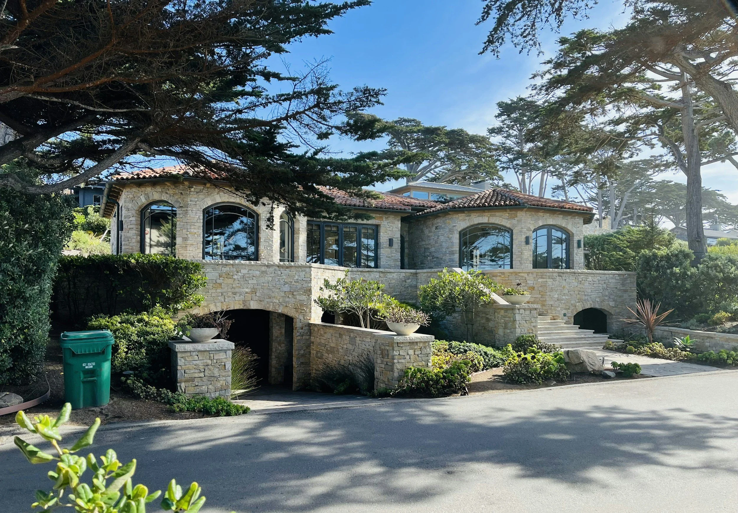 Stone Veneer home with beautiful stone walls, stairs and landscaping